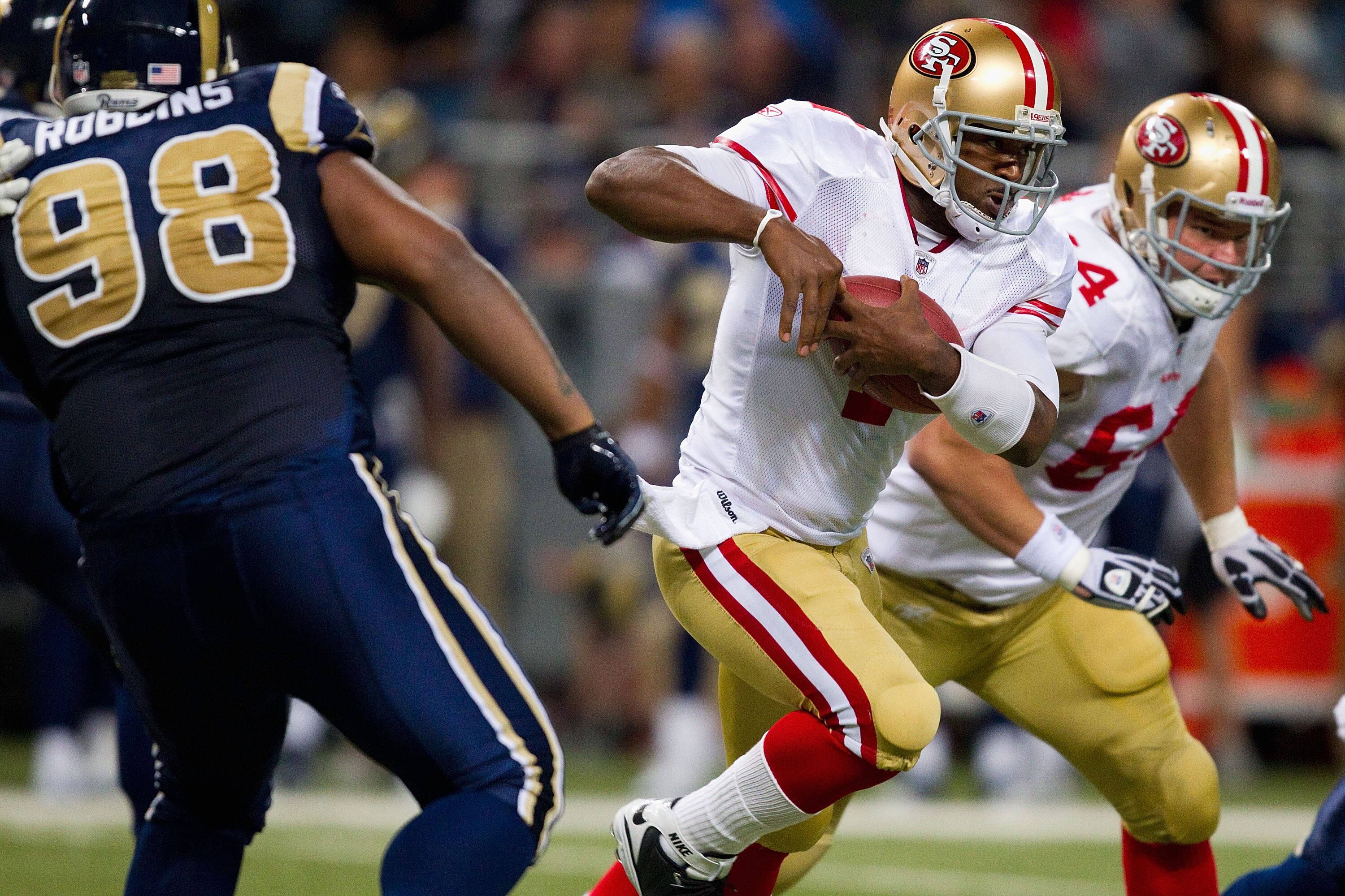 ST. LOUIS, MO - DECEMBER 26: Troy Smith #1 of the San Francisco 49ers scrambles against the St. Louis Rams at the Edward Jones Dome on December 26, 2010 in St. Louis, Missouri. The Rams beat the 49ers 25-17. (Photo by Dilip Vishwanat/Getty Images)