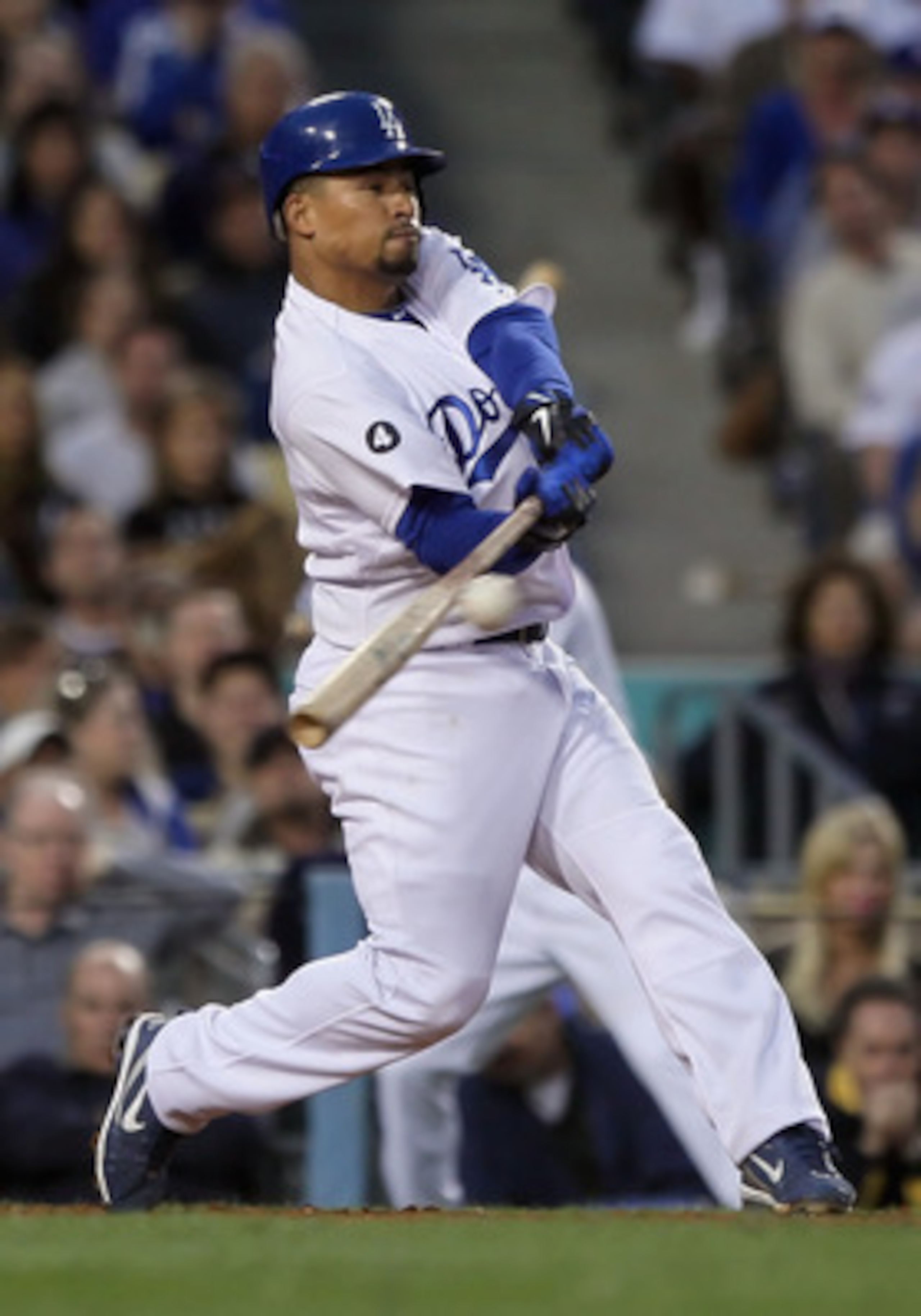 LOS ANGELES, CA - APRIL 03:  Rafael Furcal #15 of the Los Angeles Dodgers hits an RBI double in the seventh inning against the San Francisco Giants at Dodger Stadium on April 3, 2011 in Los Angeles, California. The Dodgers defeated the Giants 7-5.  (Photo