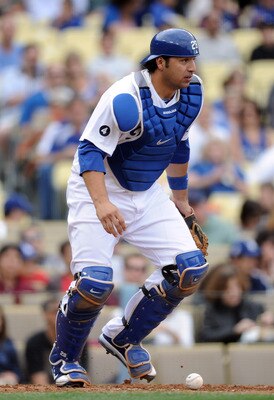 LOS ANGELES, CA - MAY 14: Rod Barajas #28 of the Los Angeles Dodgers keeps his eye on the base runners after a blocked wild pitch against the Arizona Diamondbacks at Dodger Stadium on May 14, 2011 in Los Angeles, California.  (Photo by Harry How/Getty Ima