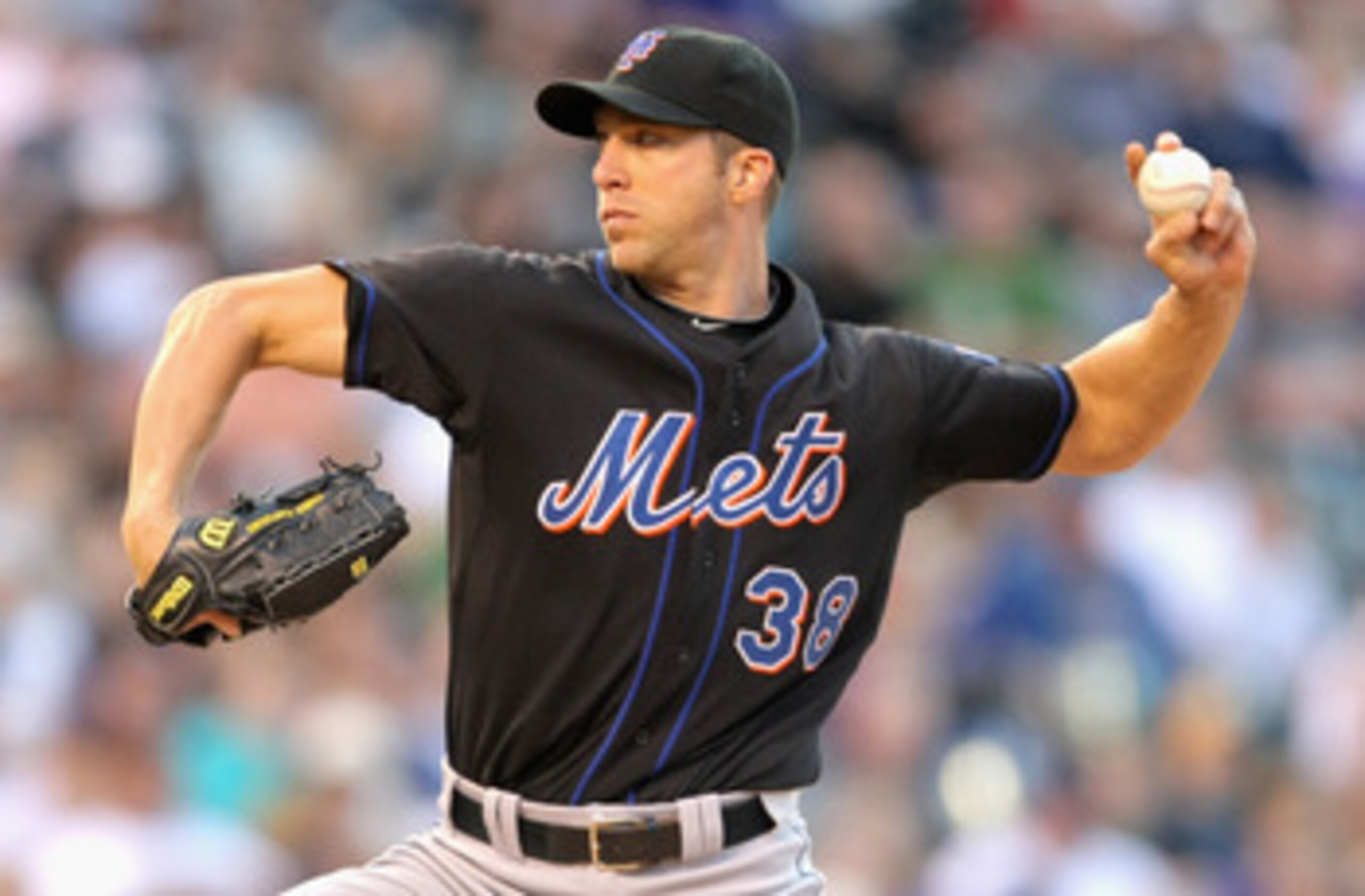 DENVER, CO - MAY 09:  Starting pitcher Chris Capuano #38 of the New York Mets delivers against the Colorado Rockies at Coors Field on May 9, 2011 in Denver, Colorado.  (Photo by Doug Pensinger/Getty Images)