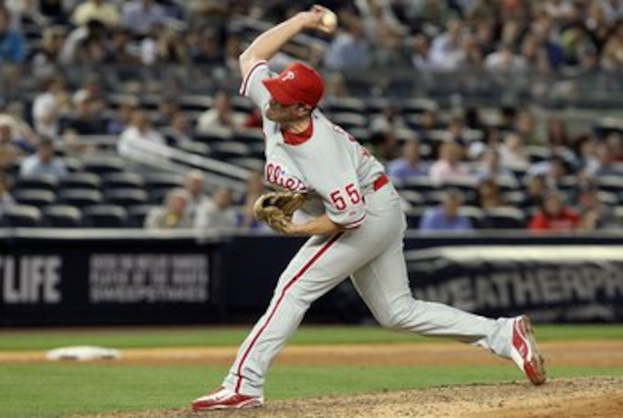 NEW YORK - JUNE 15:  Danys Baez #55 of the Philadelphia Phillies delivers a pitch against the New York Yankees on June 15, 2010 at Yankee Stadium in the Bronx borough of New York City.  (Photo by Jim McIsaac/Getty Images)