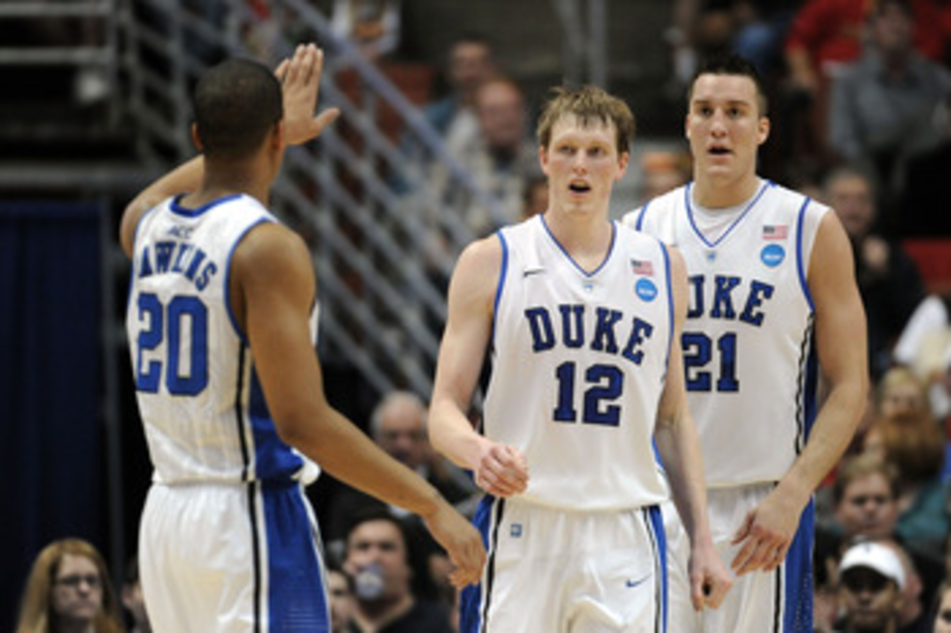 ANAHEIM, CA - MARCH 24:  Andre Dawkins #20, Kyle Singler #12 and Miles Plumlee #21 of the Duke Blue Devils reacts against the Arizona Wildcats during the west regional semifinal of the 2011 NCAA men's basketball tournament at the Honda Center on March 24,