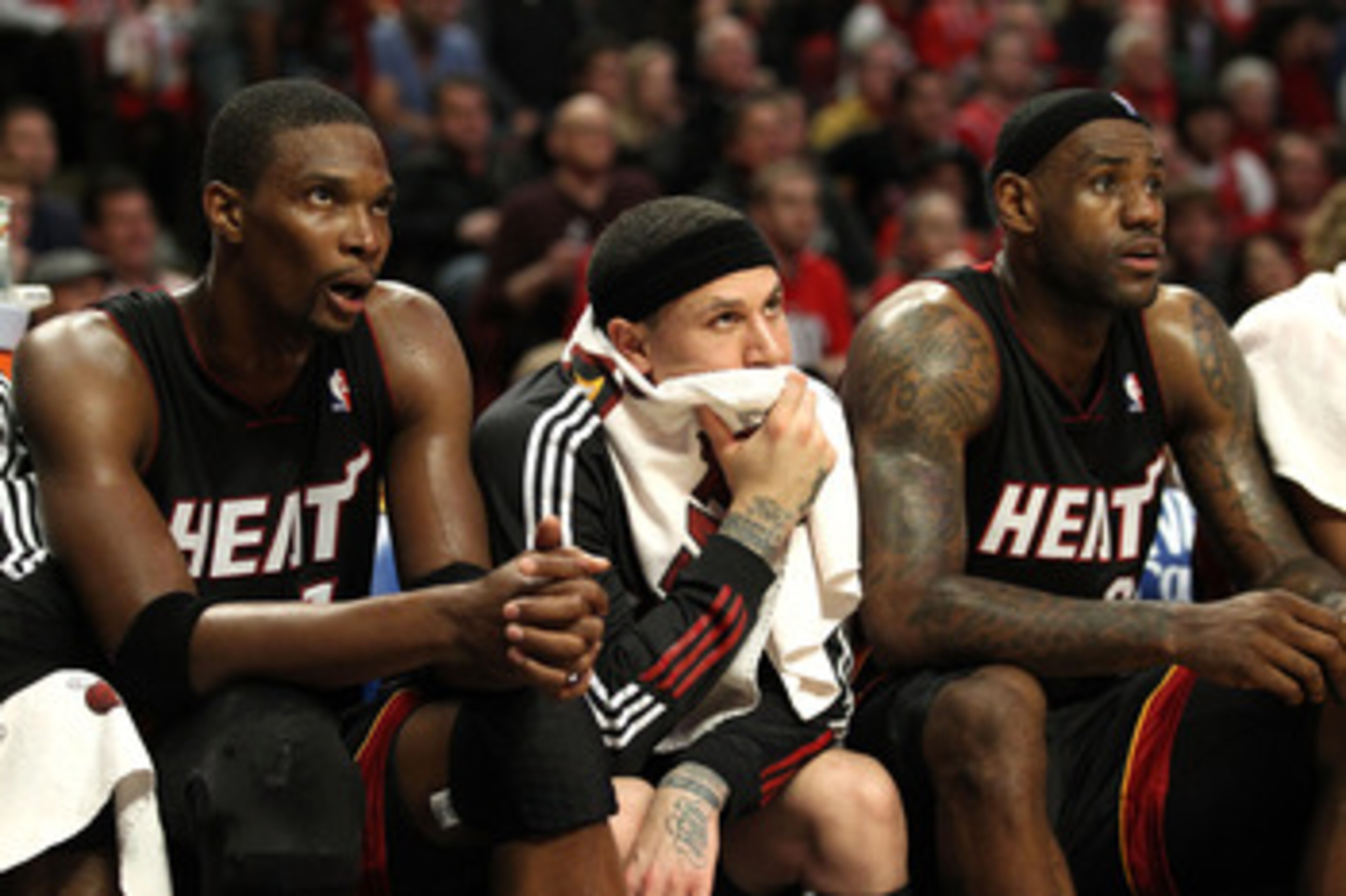 CHICAGO, IL - MAY 15:  (L-R) Chris Bosh #1, Mike Bibby #0 and LeBron James #23 of the Miami Heat look on dejected from the bench late in the fourth quarter in Game One of the Eastern Conference Finals during the 2011 NBA Playoffs on May 15, 2011 at the Un