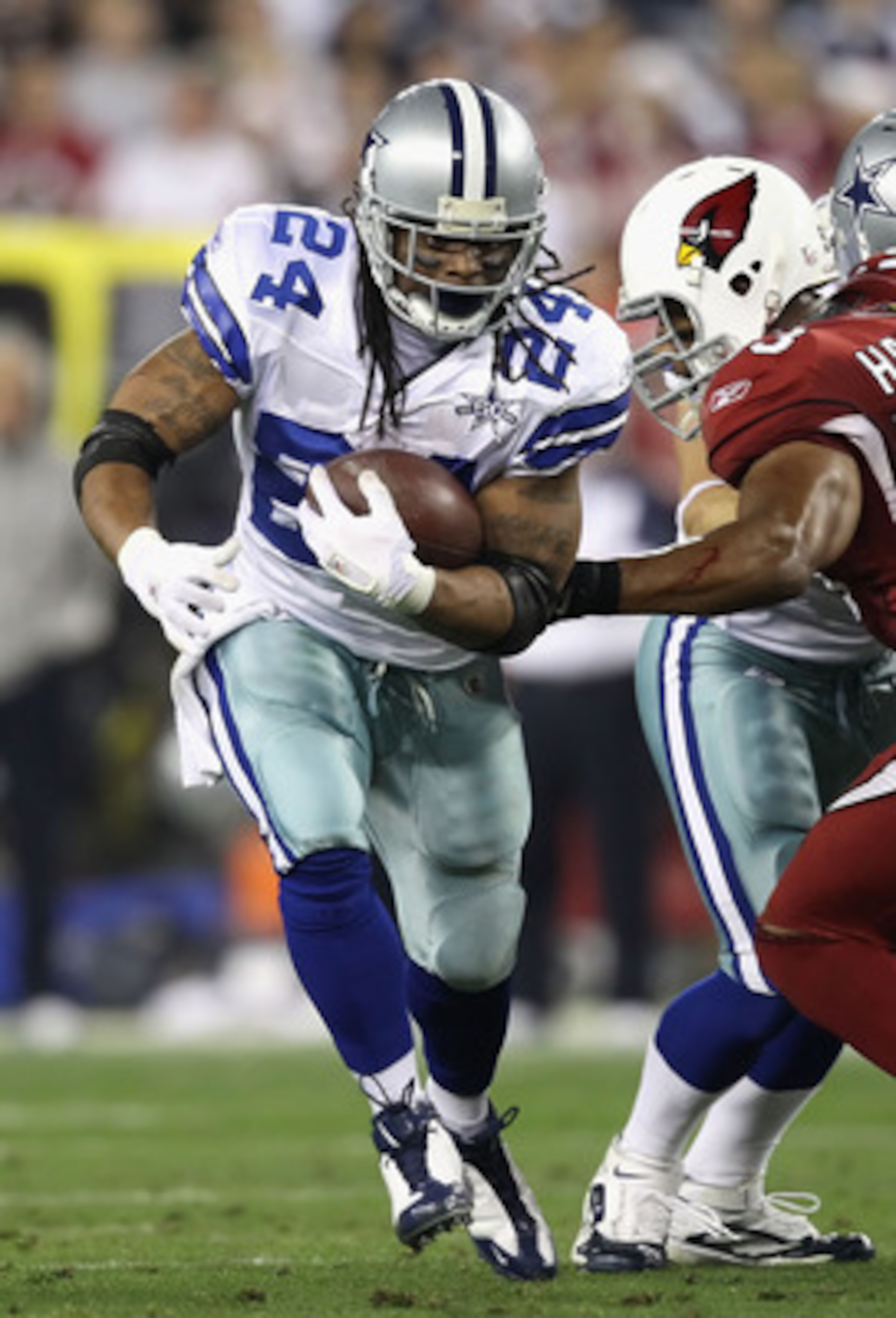 GLENDALE, AZ - DECEMBER 25: Runningback Marion Barber #24 of the Dallas Cowboys rushes the football during the NFL game against the Arizona Cardinals at the University of Phoenix Stadium on December 25, 2010 in Glendale, Arizona. The Cardinals defeated GLENDALE, AZ - DECEMBER 25: Runningback Marion Barber #24 of the Dallas Cowboys rushes the football during the NFL game against the Arizona Cardinals at the University of Phoenix Stadium on December 25, 2010 in Glendale, Arizona. The Cardinals defeated