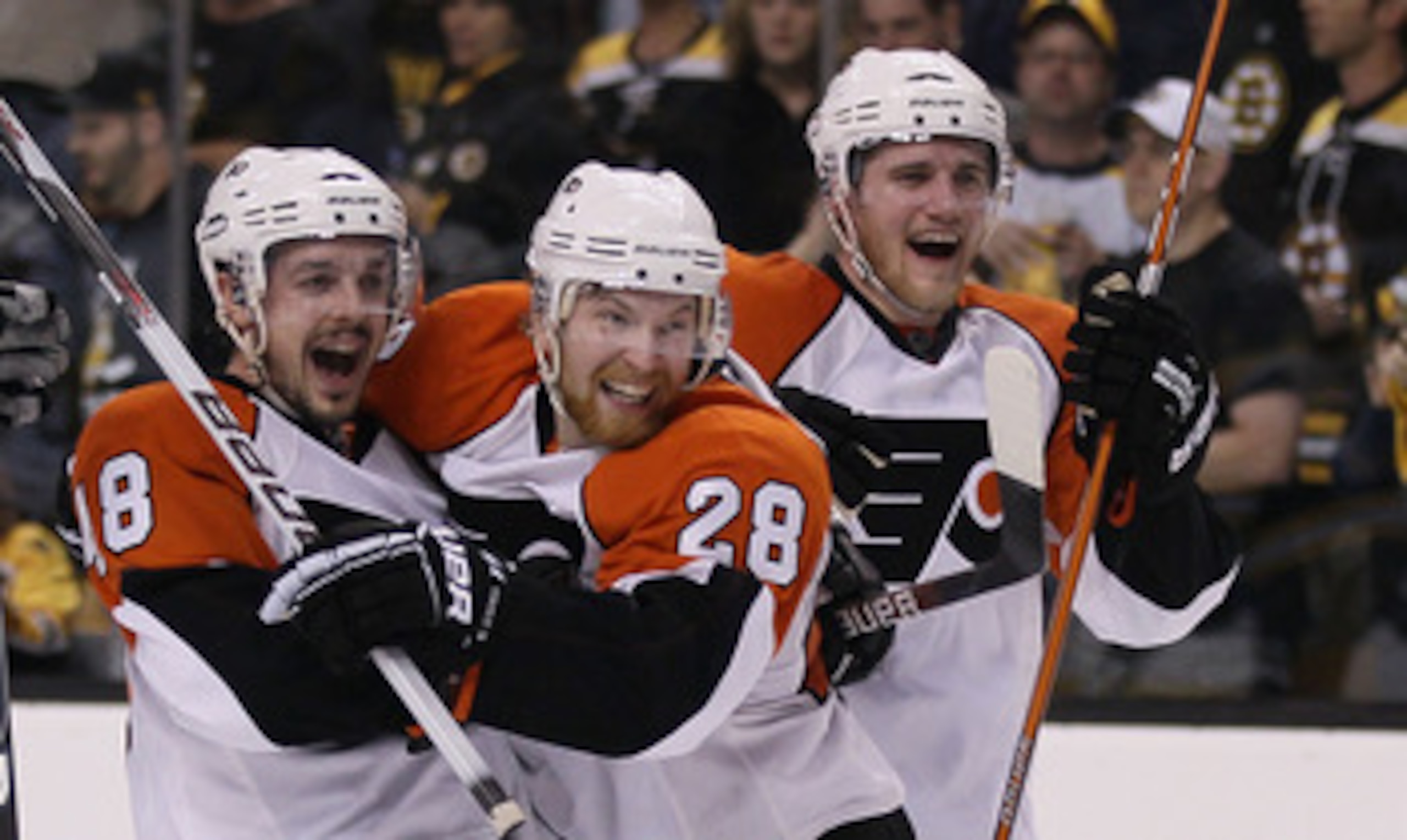 BOSTON - MAY 14:  Danny Briere #48, Claude Giroux #28 and Matt Carle #25 of the Philadelphia Flyers celebrate the win over the Boston Bruins in Game Seven of the Eastern Conference Semifinals during the 2010 NHL Stanley Cup Playoffs at TD Garden on May 14