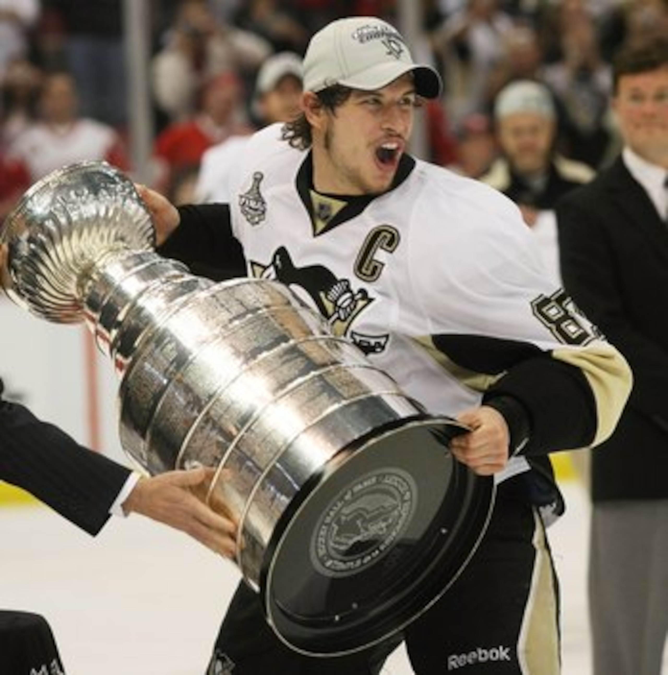 DETROIT - JUNE 12:  Sidney Crosby #87 of the Pittsburgh Penguins holds the Stanley Cup following the Penguins victory over the Detroit Red Wings in Game Seven of the 2009 NHL Stanley Cup Finals at Joe Louis Arena on June 12, 2009 in Detroit, Michigan.  (P