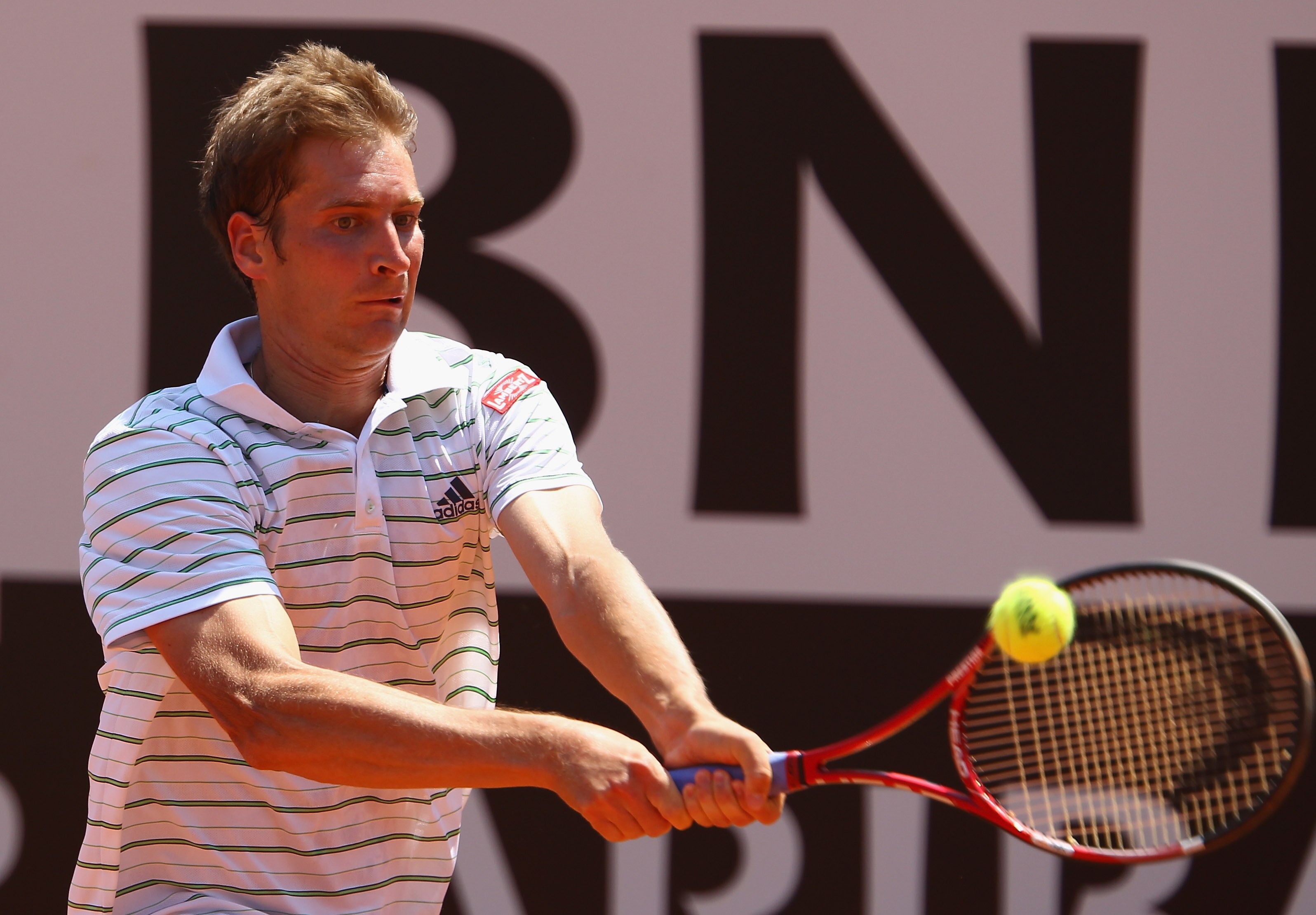 ROME, ITALY - MAY 13:  Florian Mayer of Germany plays a backhand during his quarter final match against Andy Murray of Great Britain during day six of the Internazoinali BNL D'Italia at the Foro Italico Tennis Centre  on May 13, 2011 in Rome, Italy.  (Pho