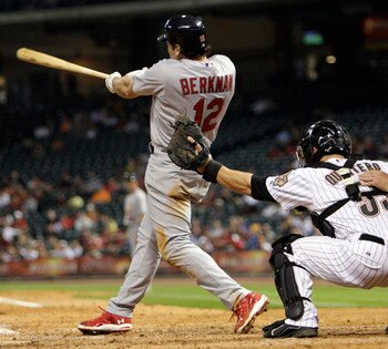 HOUSTON - APRIL 26:  Lance Berkman #12 of the St. Louis Cardinals doubles to center field in the ninth scoring Matt Holliday with the go ahead run at Minute Maid Park on April 26, 2011 in Houston, Texas. Houston won 6-5. (Photo by Bob Levey/Getty Images)