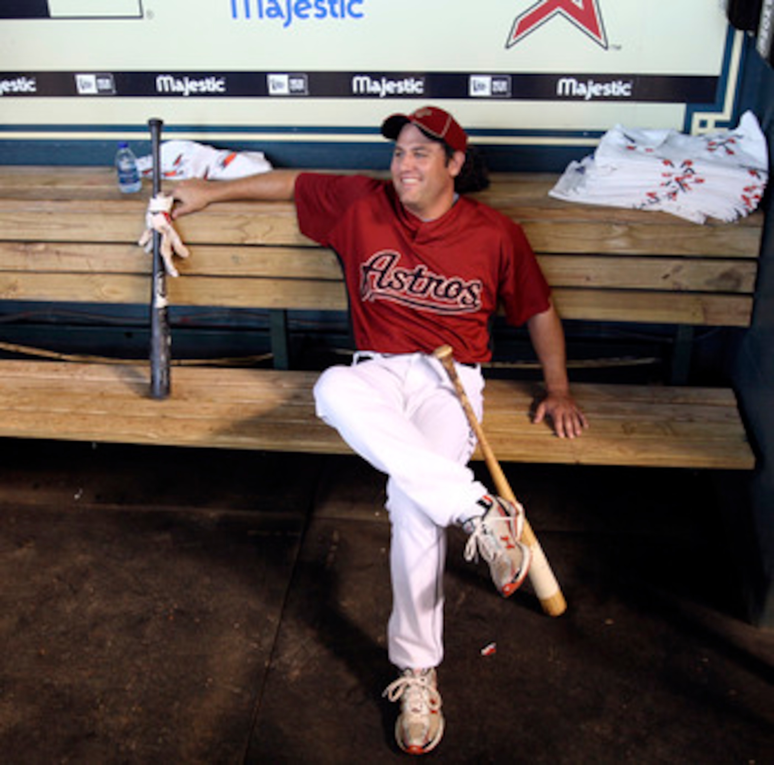HOUSTON - JULY 30:  First baseman Lance Berkman of the Houston Astros sits in the dugout during batting practice before the Milwaukee Brewers play the Houston Astros at Minute Maid Park on July 30, 2010 in Houston, Texas.  (Photo by Bob Levey/Getty Images