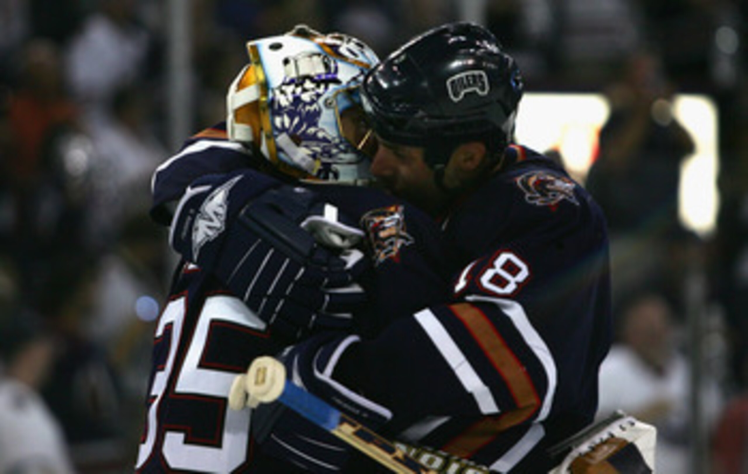 EDMONTON, AB - MAY 17:  Ethan Moreau #18 and goaltender Dwayne Roloson #35 of the Edmonton Oilers hug after defeating the San Jose Sharks in game six of the Western Conference Semifinals at Rexall Place on May 17, 2006 in Edmonton, Alberta, Canada.  The O