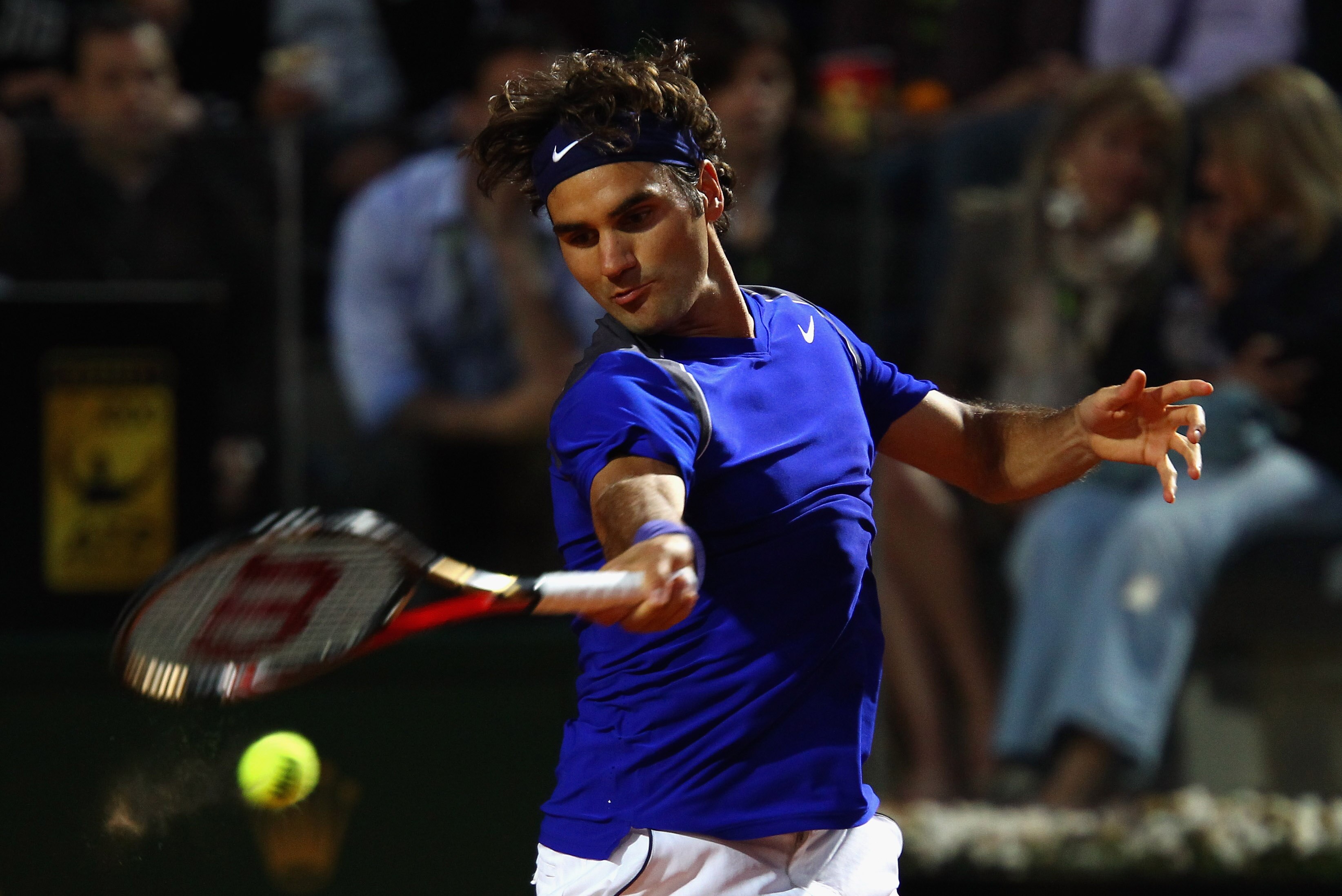 ROME, ITALY - MAY 11:  Roger Federer of Switzerland plays a forehand during his second round match against Jo-Wilfried Tsonga of France during day four of the Internazoinali BNL D'Italia at the Foro Italico Tennis Centre on May 11, 2011 in Rome, Italy.  (
