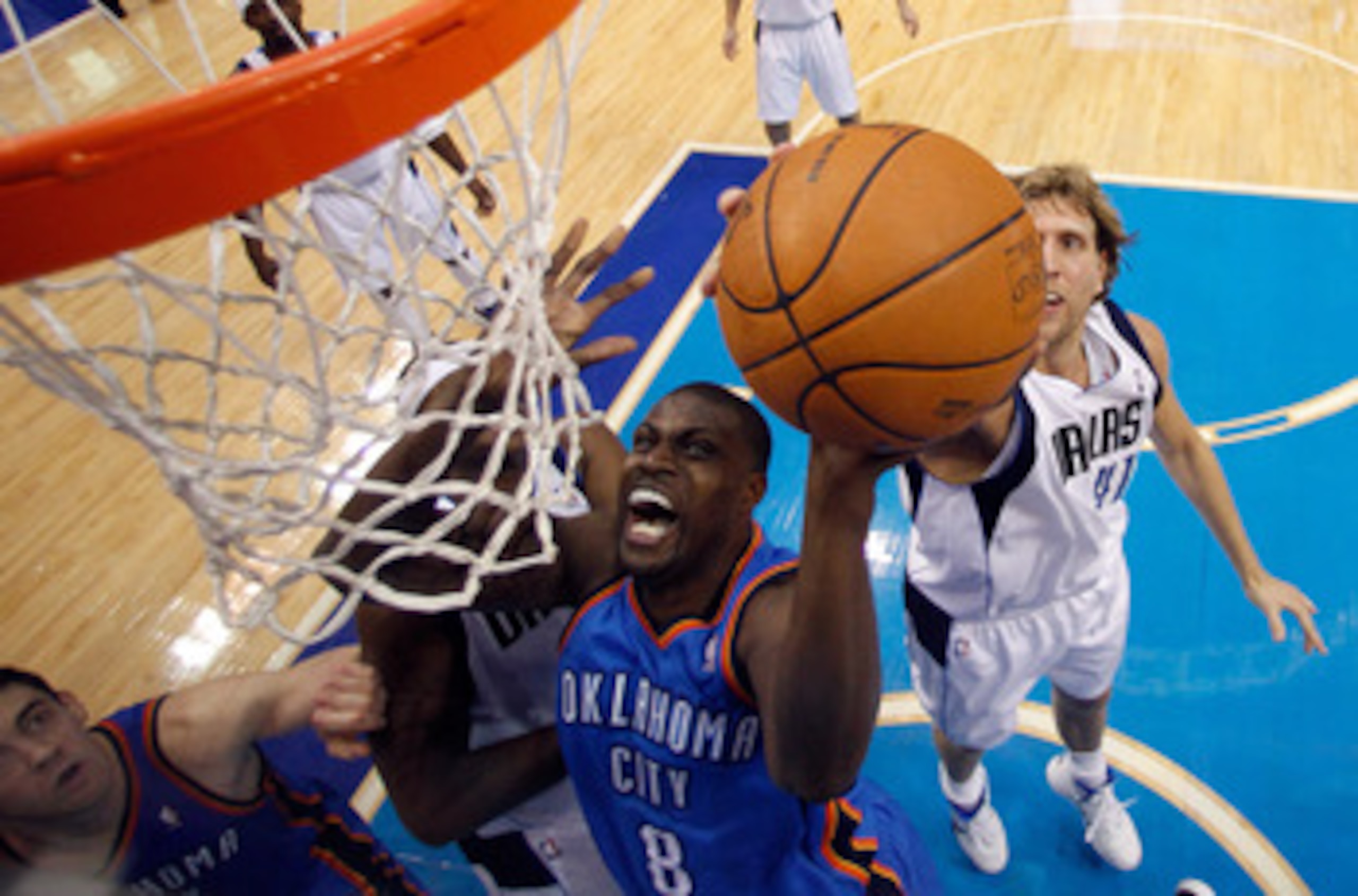 DALLAS, TX - MAY 17:  Nazr Mohammed #8 of the Oklahoma City Thunder goes up for a shot in front of Dirk Nowitzki #41 of the Dallas Mavericks in the first half in Game One of the Western Conference Finals during the 2011 NBA Playoffs at American Airlines C