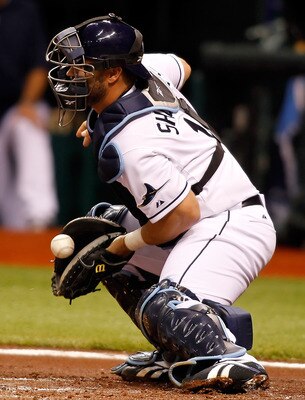 ST. PETERSBURG, FL - APRIL 02:  Catcher Kelly Shoppach #10 of the Tampa Bay Rays makes a stop against the Baltimore Orioles during the game at Tropicana Field on April 2, 2011 in St. Petersburg, Florida.  (Photo by J. Meric/Getty Images)