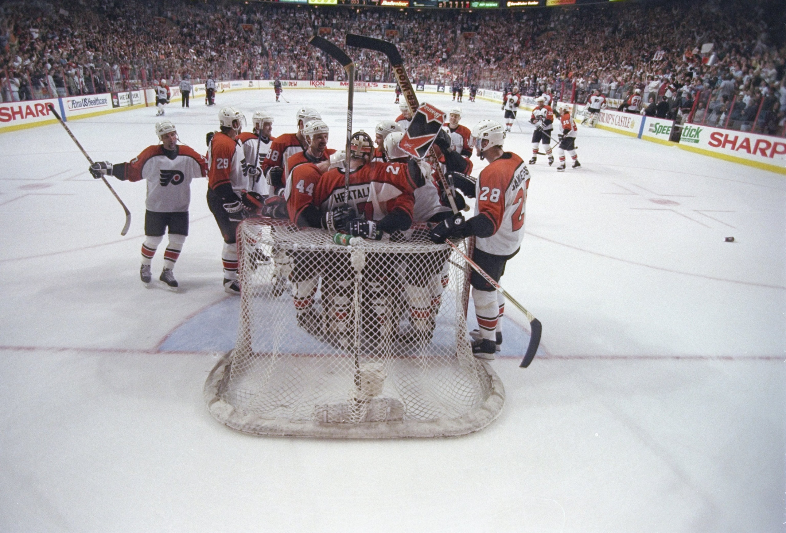 25 May 1997: Members of the Philadelphia Flyers surround goaltender Ron Hextall after winning a playoff game against the New York Rangers at the Corestates Center in Philadelphia, Pennsylvania. The Flyers won the game 4-2. 25 May 1997: Members of the Philadelphia Flyers surround goaltender Ron Hextall after winning a playoff game against the New York Rangers at the Corestates Center in Philadelphia, Pennsylvania. The Flyers won the game 4-2.