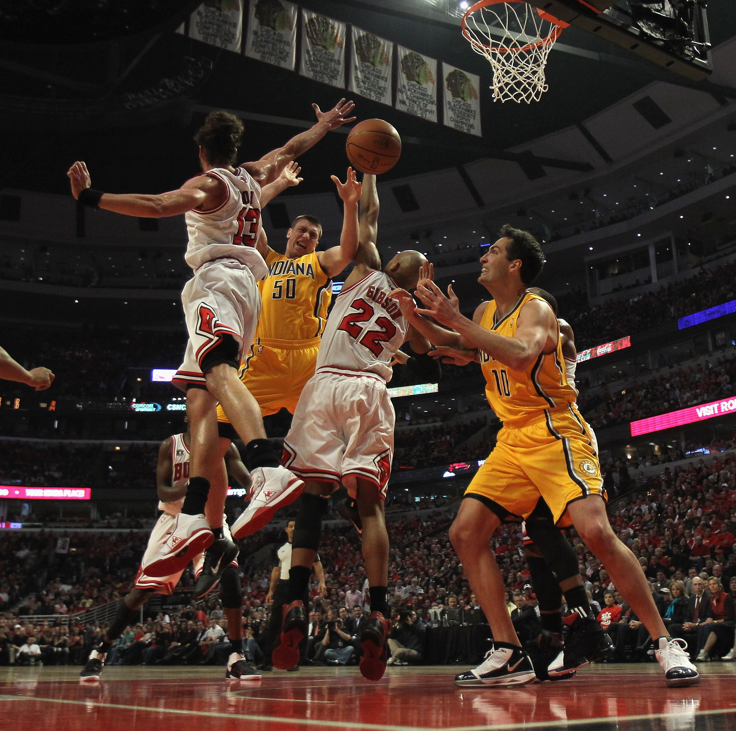 CHICAGO, IL - APRIL 26: Tyler Hansbrough #50 of the Indiana Pacers looses control of the ball under pressure from Joakim Noah #13 and Taj Gibson #22 of the Chicago Bulls as Jeff Foster #10 moves to the ball in Game Five of the Eastern Conference Quarterfi
