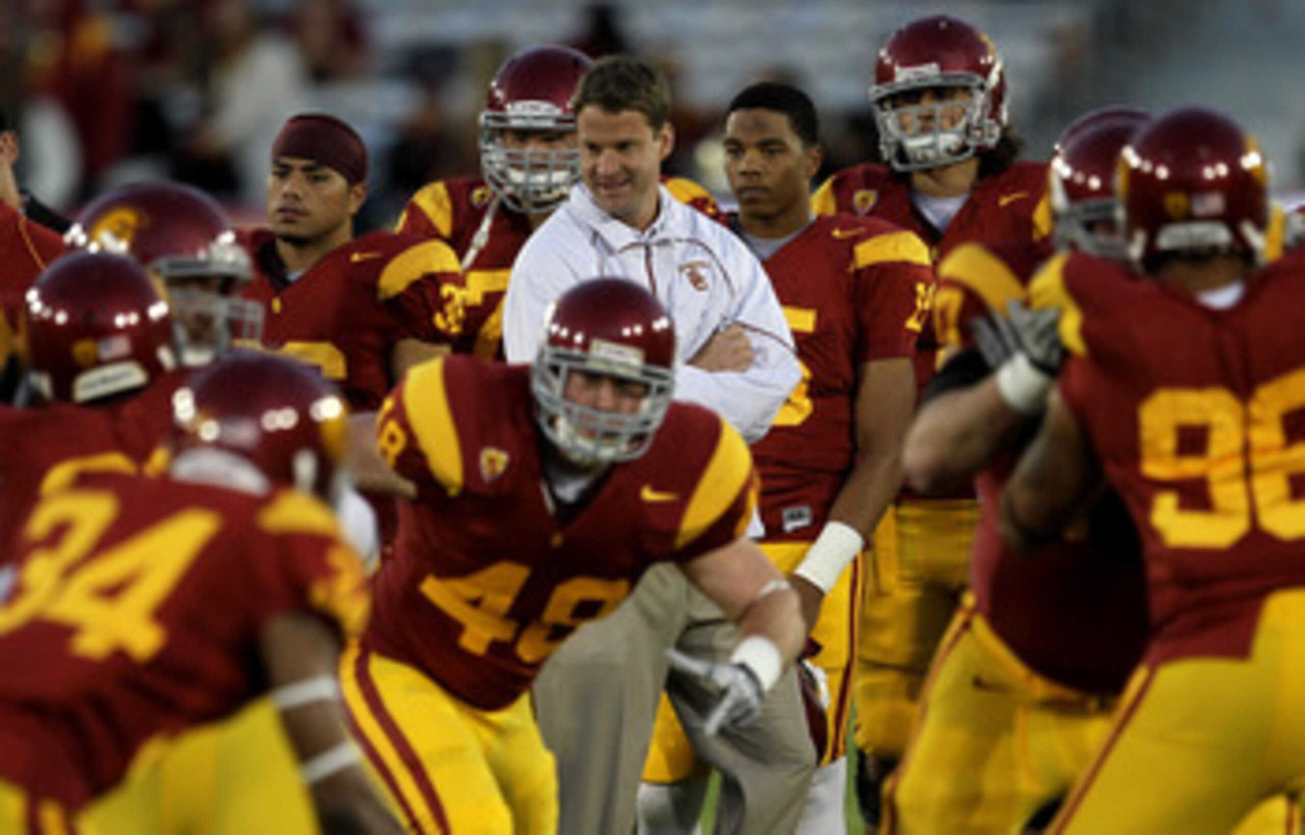 LOS ANGELES - NOVEMBER 27: Head coach Lane Kiffin of the USC Trojans watches warmups for the game with the Notre Dame Fighting Irish at the Los Angeles Memorial Coliseum on November 27, 2010 in Los Angeles, California. (Photo by Stephen Dunn/Getty Imag LOS ANGELES - NOVEMBER 27: Head coach Lane Kiffin of the USC Trojans watches warmups for the game with the Notre Dame Fighting Irish at the Los Angeles Memorial Coliseum on November 27, 2010 in Los Angeles, California. (Photo by Stephen Dunn/Getty Imag