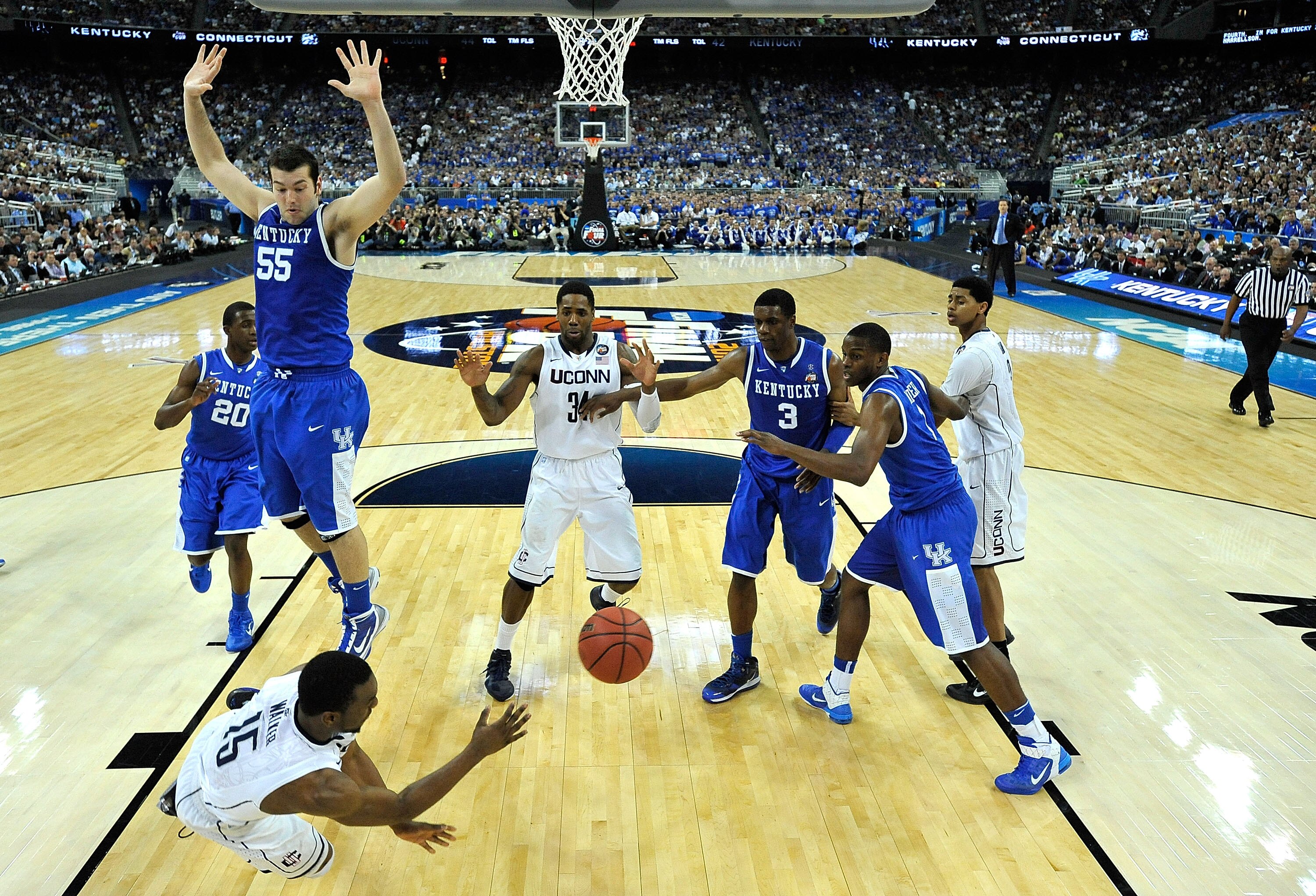 HOUSTON, TX - APRIL 02:  Kemba Walker #15 of the Connecticut Huskies dives to save a ball from going out of bounds against the Kentucky Wildcats during the National Semifinal game of the 2011 NCAA Division I Men's Basketball Championship at Reliant Stadiu