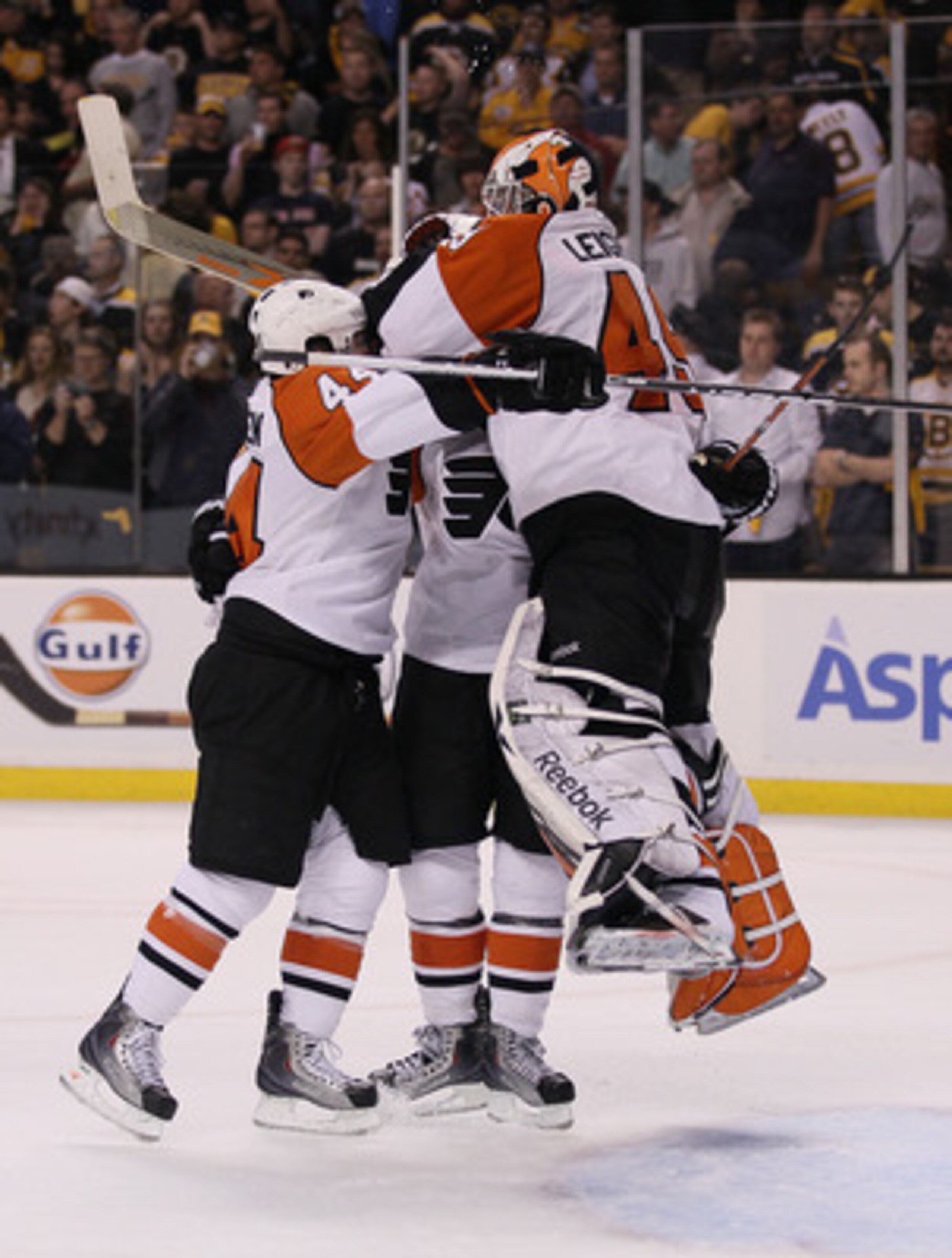 BOSTON - MAY 14:  Kimmo Timonen #44 and Mike Richards #18 of the Philadelphia Flyers celebrates the win with goalie Michael Leighton #49 after defeated the Boston Bruins in Game Seven of the Eastern Conference Semifinals during the 2010 NHL Stanley Cup Pl