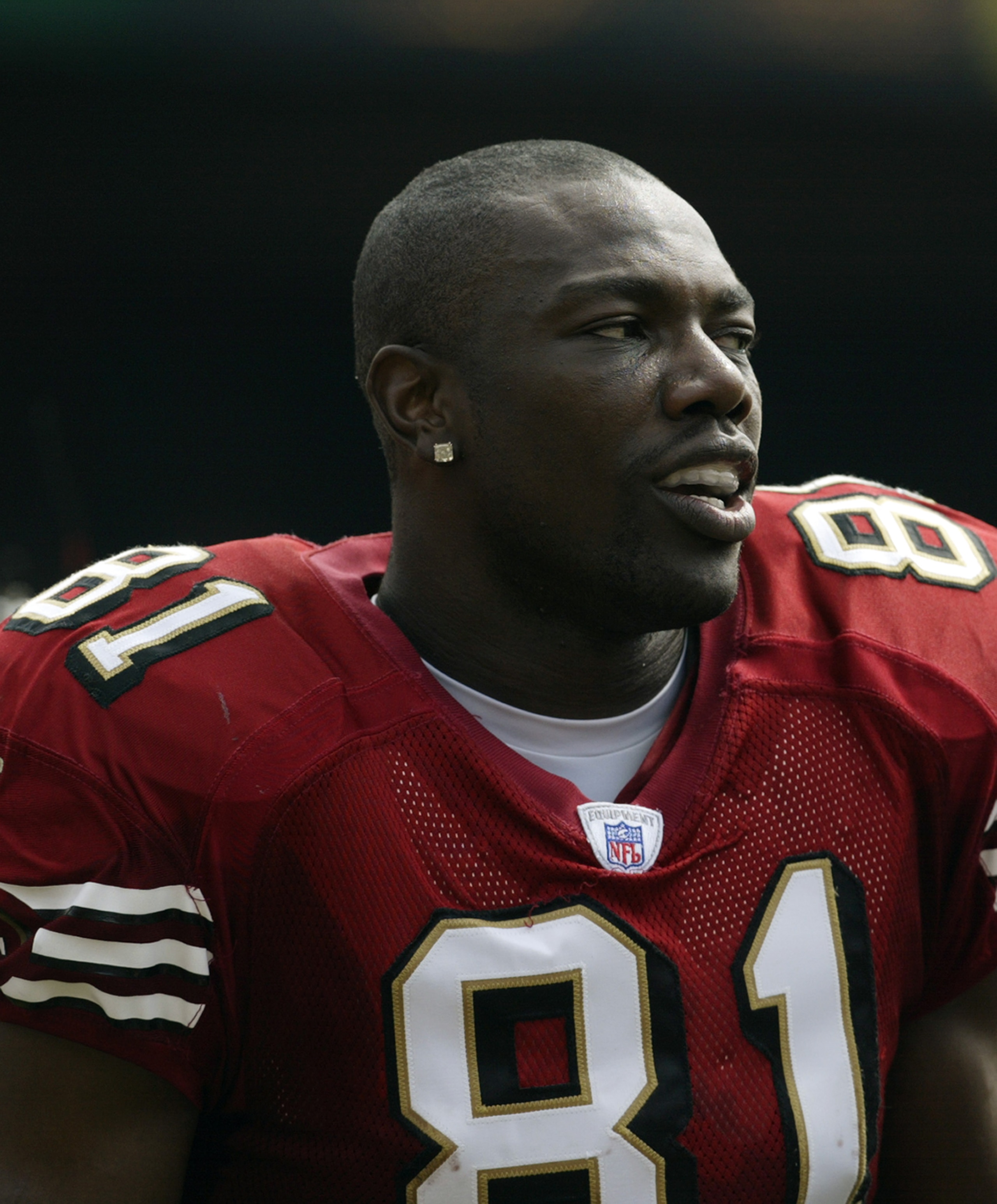 SAN FRANCISCO - SEPTEMBER 7:  Wide receiver Terrell Owens #81 of the San Francisco 49ers watches the action during the game against the Chicago Bears on September 7, 2003 at Candelstick Park in San Francisco, California. The 49ers defeated the Bears 49-7.