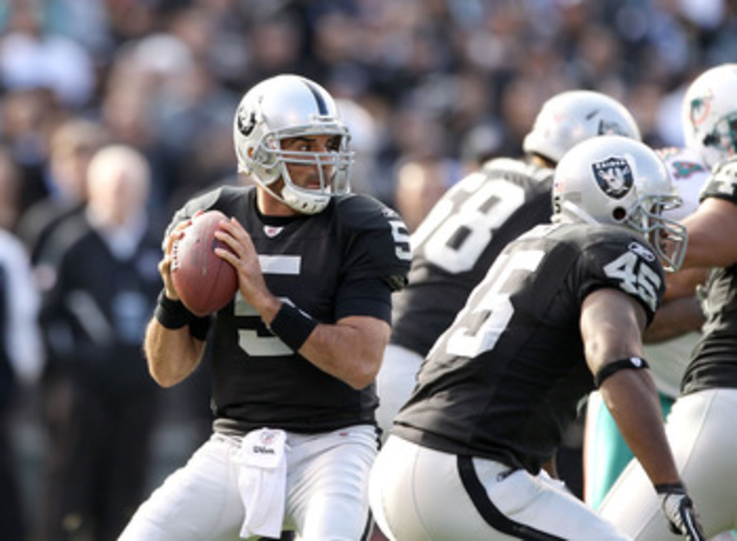 OAKLAND, CA - NOVEMBER 28:  Bruce Gradkowski #5 of the Oakland Raiders in action against the Miami Dolphins at Oakland-Alameda County Coliseum on November 28, 2010 in Oakland, California.  (Photo by Ezra Shaw/Getty Images)