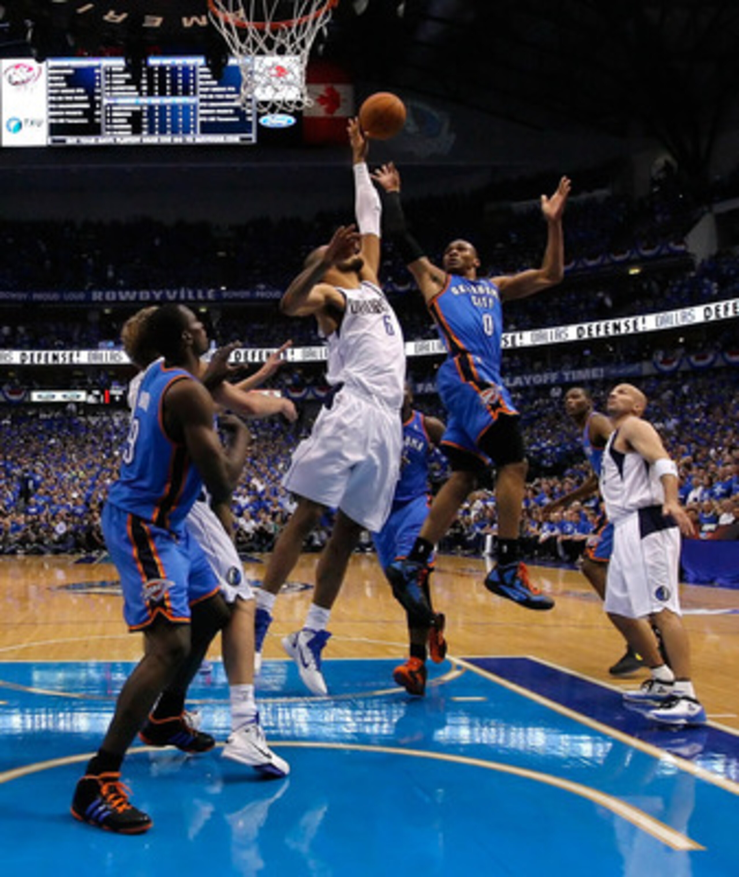 DALLAS, TX - MAY 17:  Russell Westbrook #0 of the Oklahoma City Thunder shoots over Tyson Chandler #6 of the Dallas Mavericks in the second half in Game One of the Western Conference Finals during the 2011 NBA Playoffs at American Airlines Center on May 1