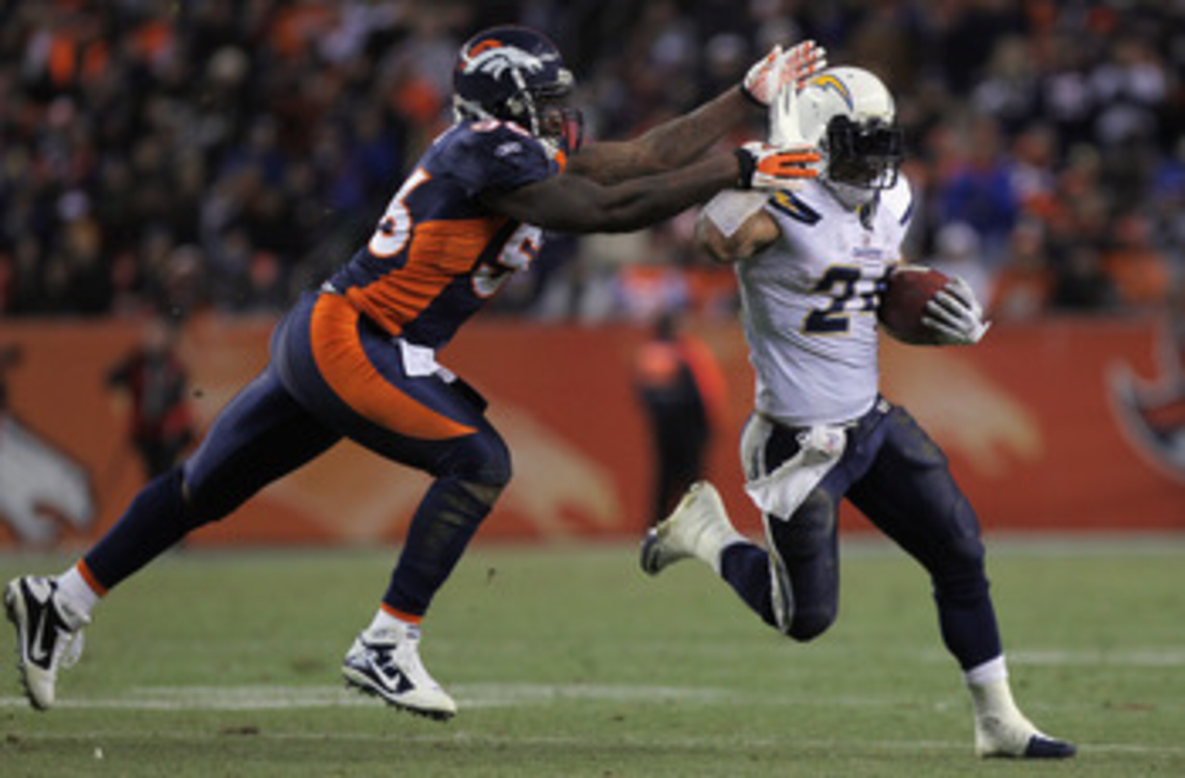 DENVER - JANUARY 02: Running back Ryan Mathews #24 of the San Diego Chargers eludes linebacker Robert Ayers #56 of the Denver Broncos as he rushes for a 31 yard touchdown on fourth down and one yard to go in the fourth quarter at INVESCO Field at Mile Hi DENVER - JANUARY 02: Running back Ryan Mathews #24 of the San Diego Chargers eludes linebacker Robert Ayers #56 of the Denver Broncos as he rushes for a 31 yard touchdown on fourth down and one yard to go in the fourth quarter at INVESCO Field at Mile Hi