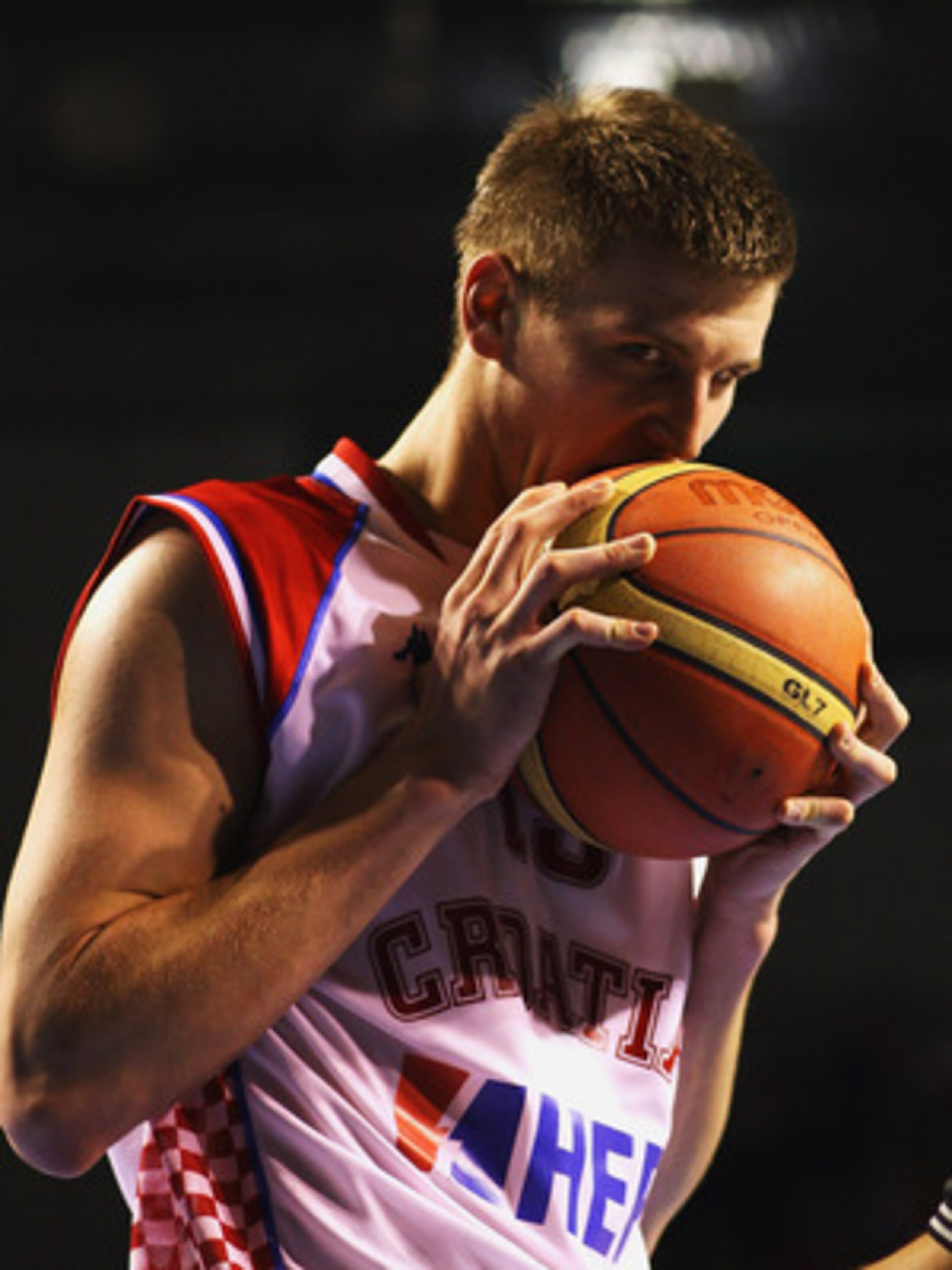AUCKLAND, NEW ZEALAND - JULY 11:  Tomislav Zubcic of Croatia bites on the ball during the U19 Basketball World Championships Semi-Final match between Croatia and the United States of America at North Shore Events Centre on July 11, 2009 in Auckland, New Z