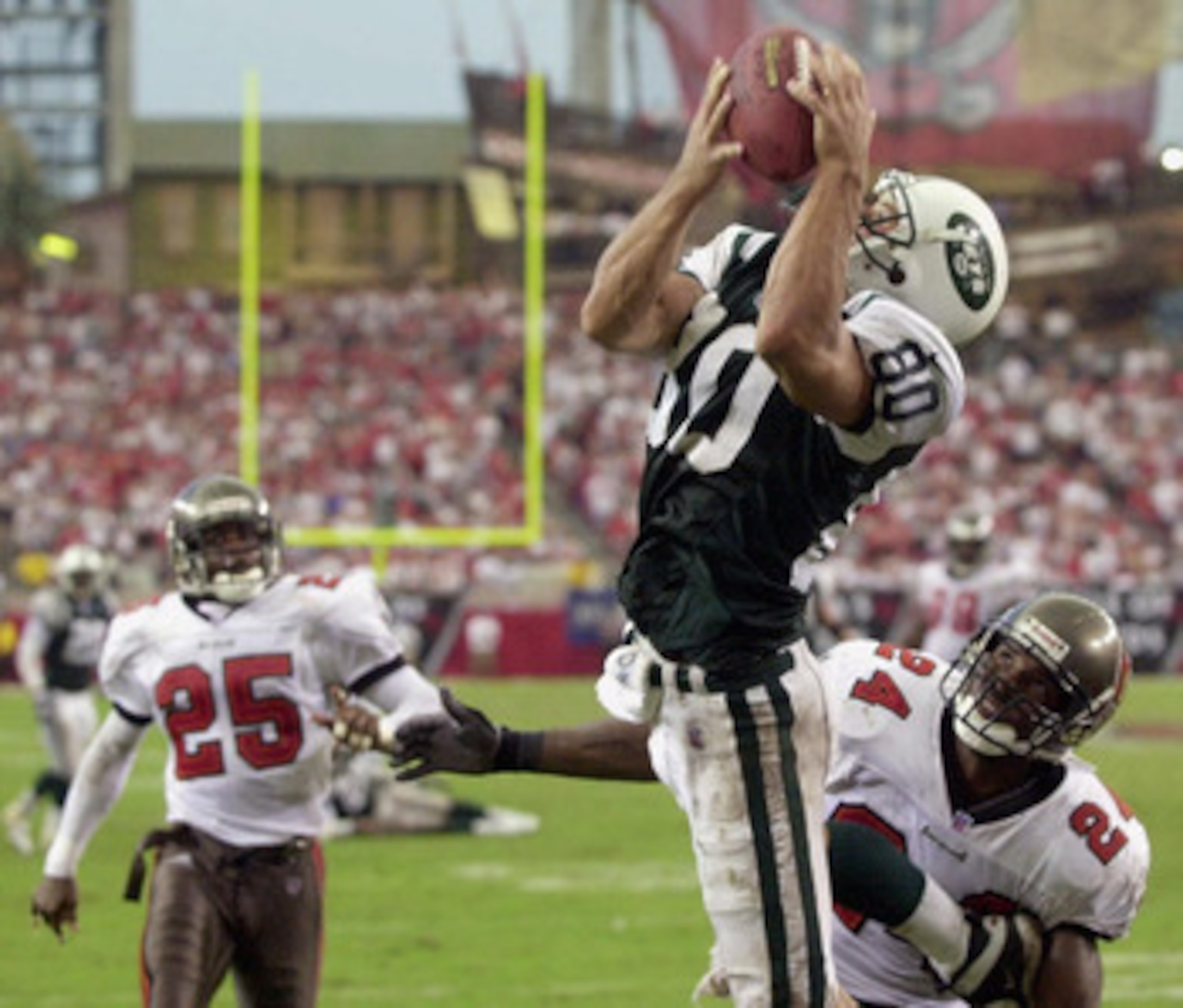 Wayne Chrebet catching a touchdown pass from Curtis Martin.