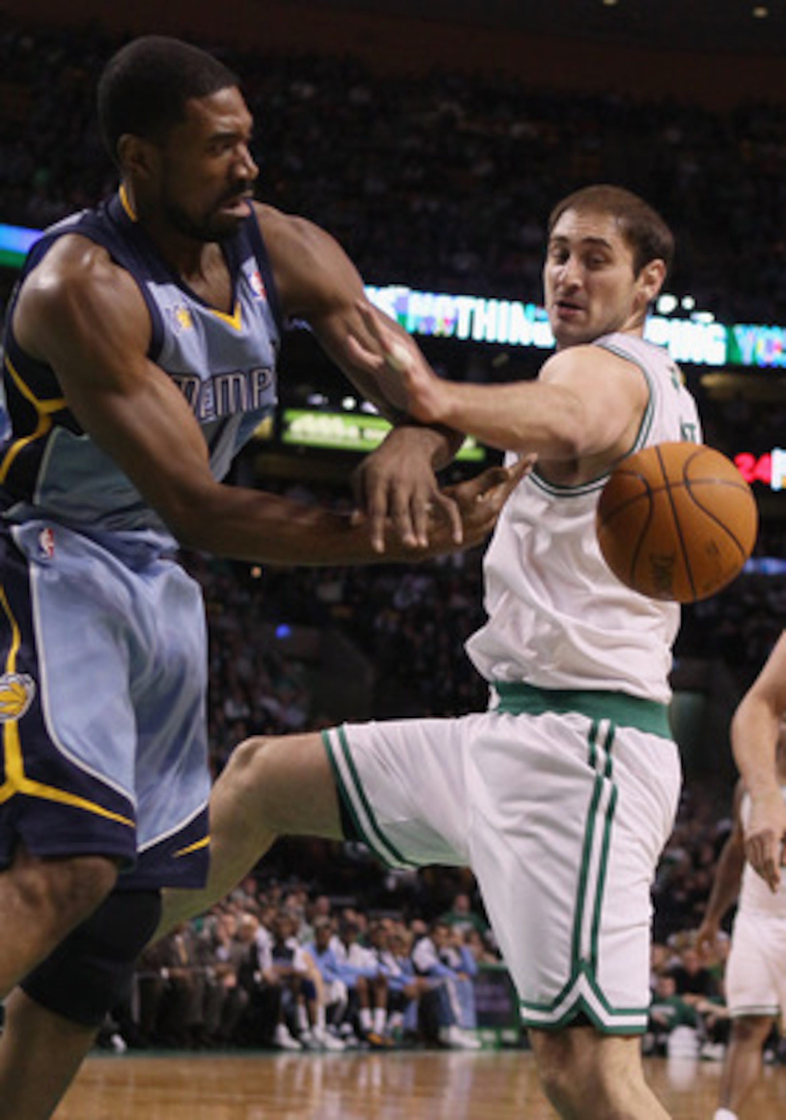 BOSTON, MA - MARCH 23:  Leon Powe #7 of the Memphis Grizzlies and Nenad Krstic #4 of the Boston Celtics fight for the ball on March 23, 2011 at the TD Garden in Boston, Massachusetts.  The Memphis Grizzlies defeated the Boston Celtics 90-87. NOTE TO USER: