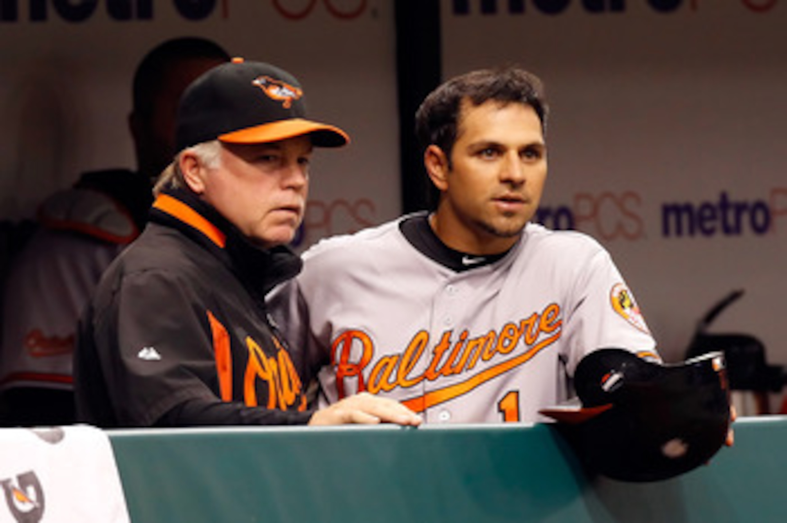 ST. PETERSBURG, FL - MAY 14:  Manager Buck Showalter of the Baltimore Orioles talks with Brian Roberts #1 during the game against the Tampa Bay Rays at Tropicana Field on May 14, 2011 in St. Petersburg, Florida.  (Photo by J. Meric/Getty Images)