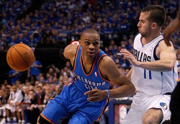 DALLAS, TX - MAY 17:  Russell Westbrook #0 of the Oklahoma City Thunder drives on Jose Juan Barea #11 of the Dallas Mavericks in the second quarter in Game One of the Western Conference Finals during the 2011 NBA Playoffs at American Airlines Center on Ma