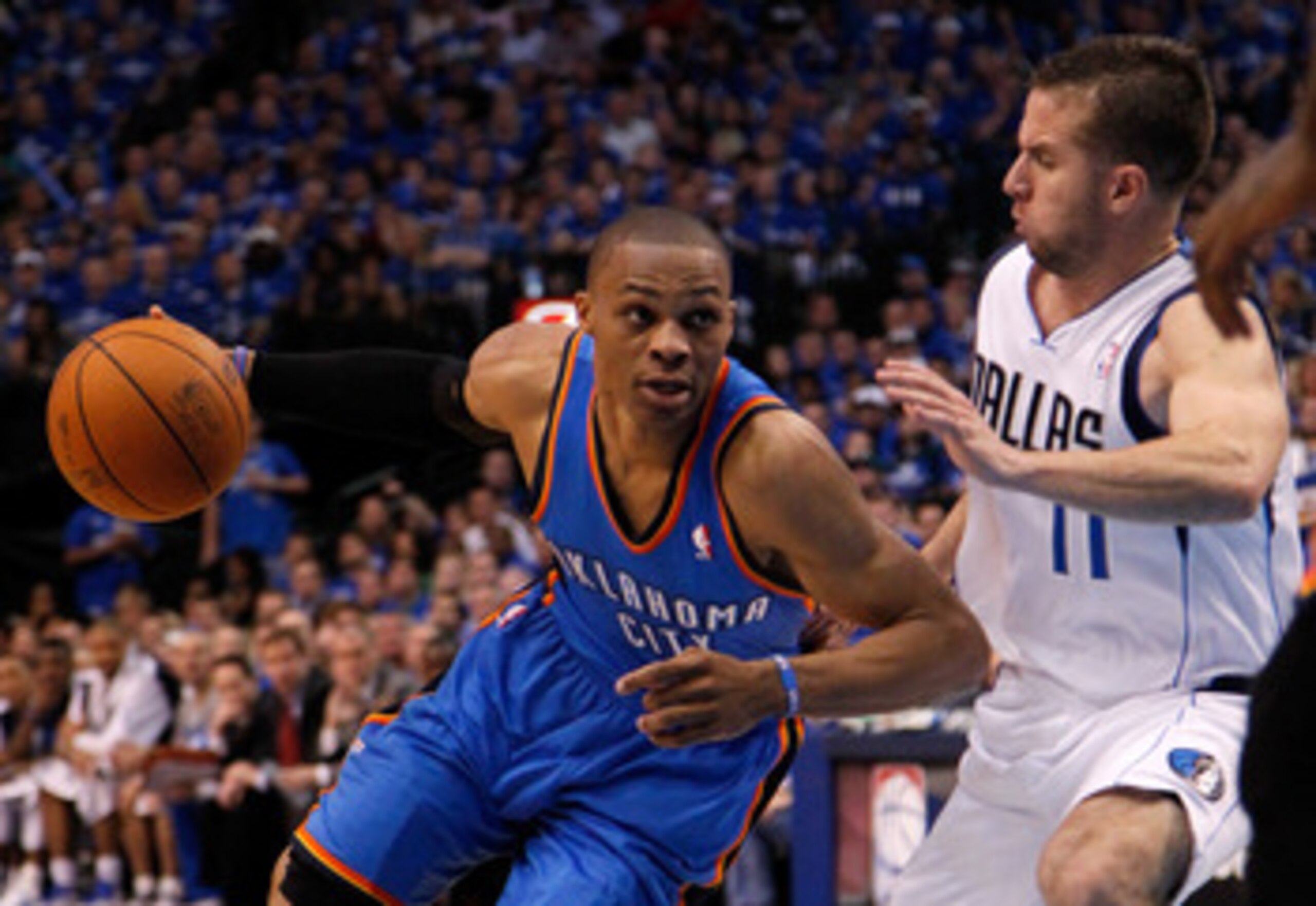 DALLAS, TX - MAY 17:  Russell Westbrook #0 of the Oklahoma City Thunder drives on Jose Juan Barea #11 of the Dallas Mavericks in the second quarter in Game One of the Western Conference Finals during the 2011 NBA Playoffs at American Airlines Center on Ma