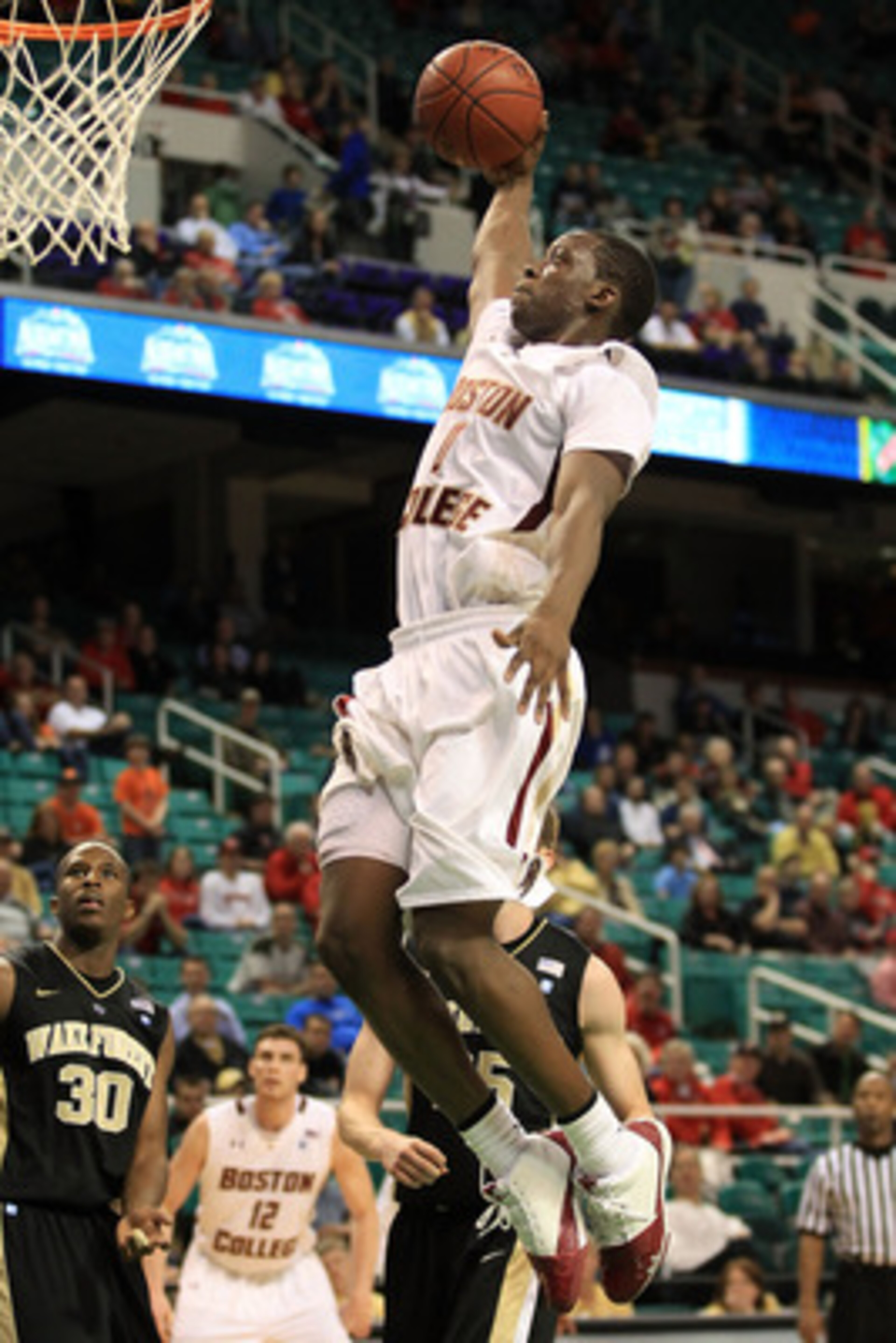 GREENSBORO, NC - MARCH 10:  Reggie Jackson #0 of the Boston College Eagles shoots against Travis McKie #30 of the Wake Forest Demon Deacons during the second half of the game in the first round of the 2011 ACC men's basketball tournament at the Greensboro
