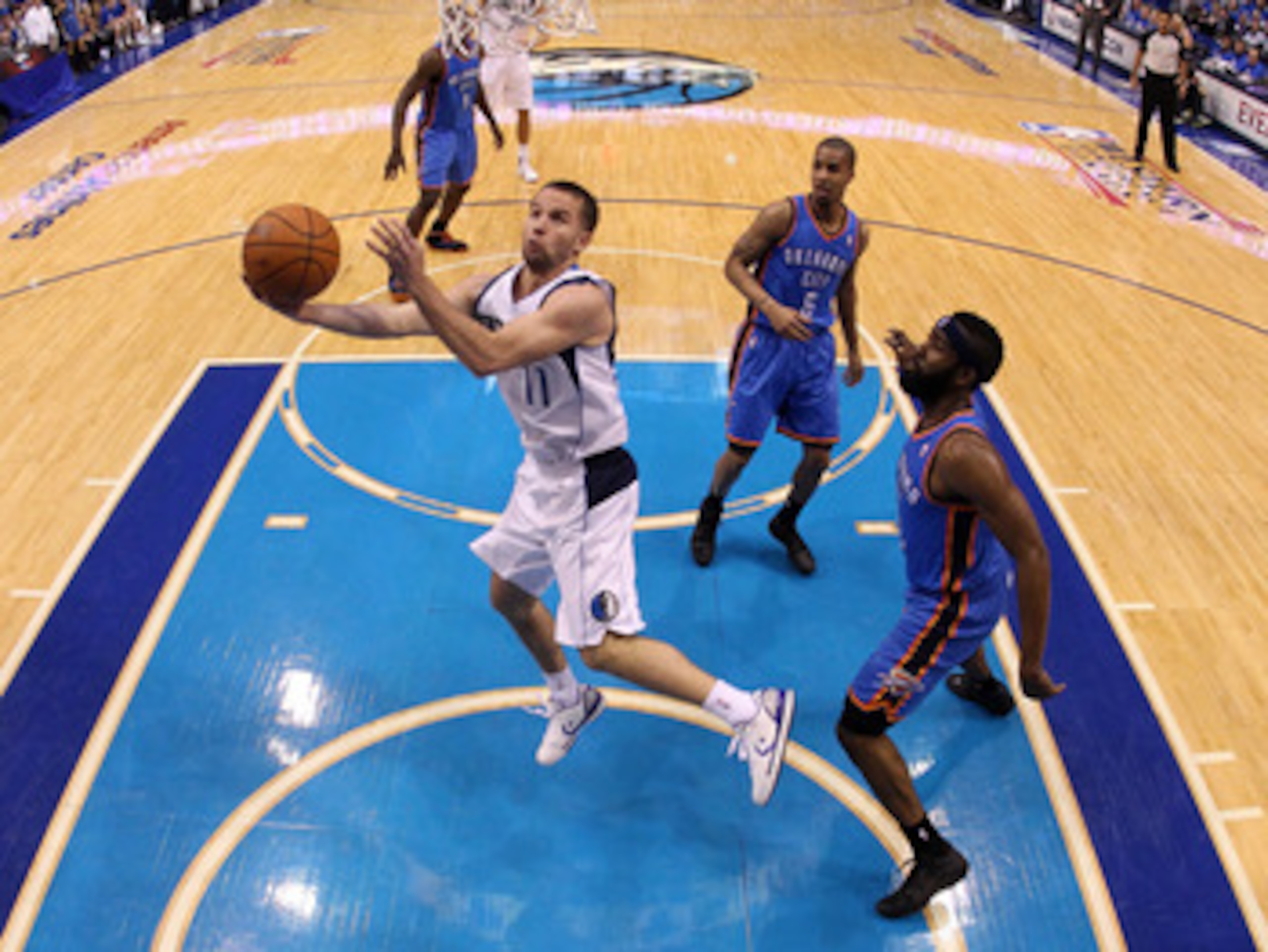 DALLAS, TX - MAY 17:  Jose Juan Barea #11 of the Dallas Mavericks goes up for a shot against James Harden #13 of the Oklahoma City Thunder in the second half in Game One of the Western Conference Finals during the 2011 NBA Playoffs at American Airlines Ce