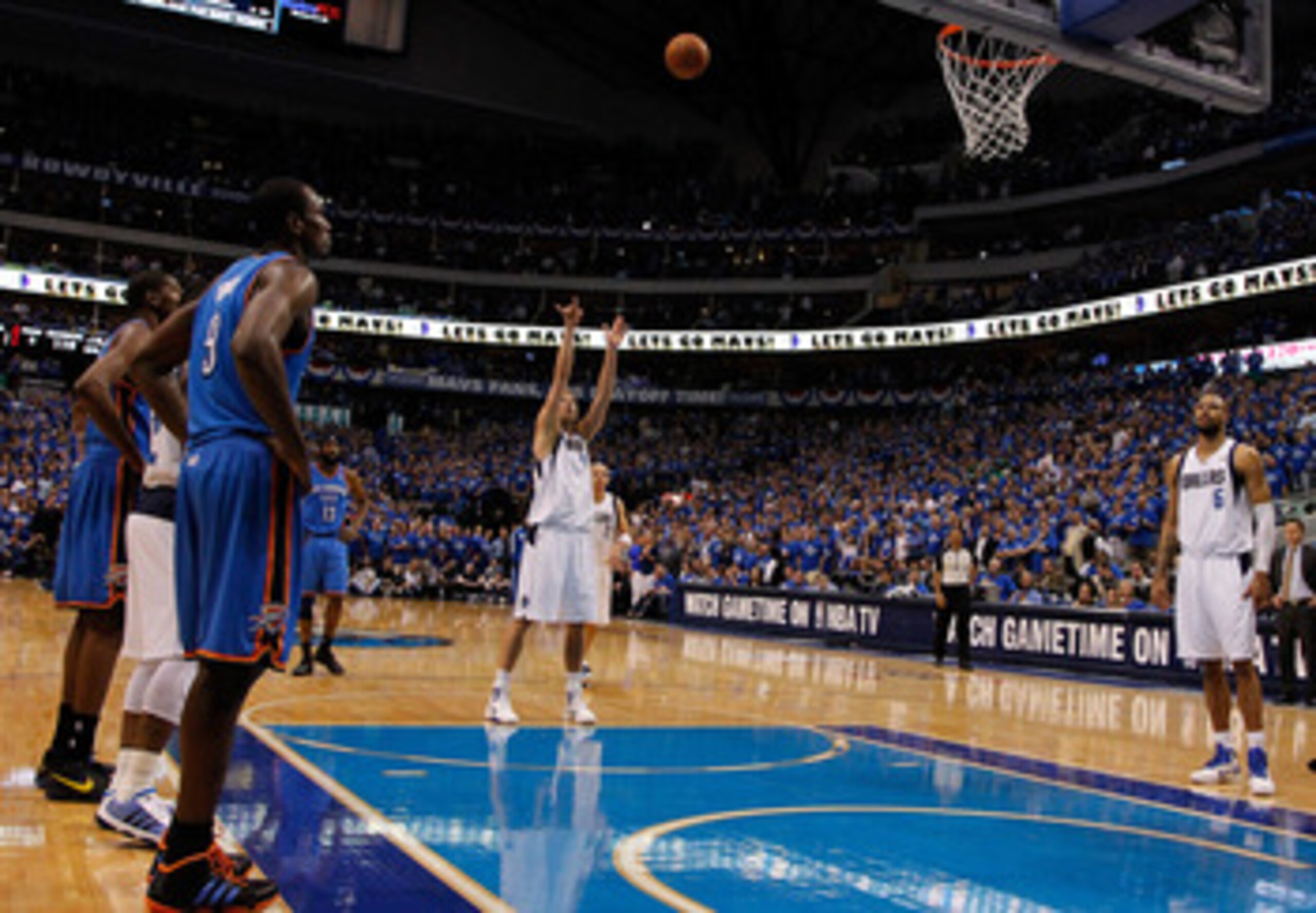 DALLAS, TX - MAY 17:  Dirk Nowitzki #41 of the Dallas Mavericks shoots a free throw late in the fourth quarter while taking on the Oklahoma City Thunder in Game One of the Western Conference Finals during the 2011 NBA Playoffs at American Airlines Center