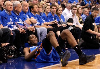 DALLAS, TX - MAY 17:  Kevin Durant #35 of the Oklahoma City Thunder reacts as he falls in front of the courtside seats in the first half while taking on the Dallas Mavericks in Game One of the Western Conference Finals during the 2011 NBA Playoffs at Amer