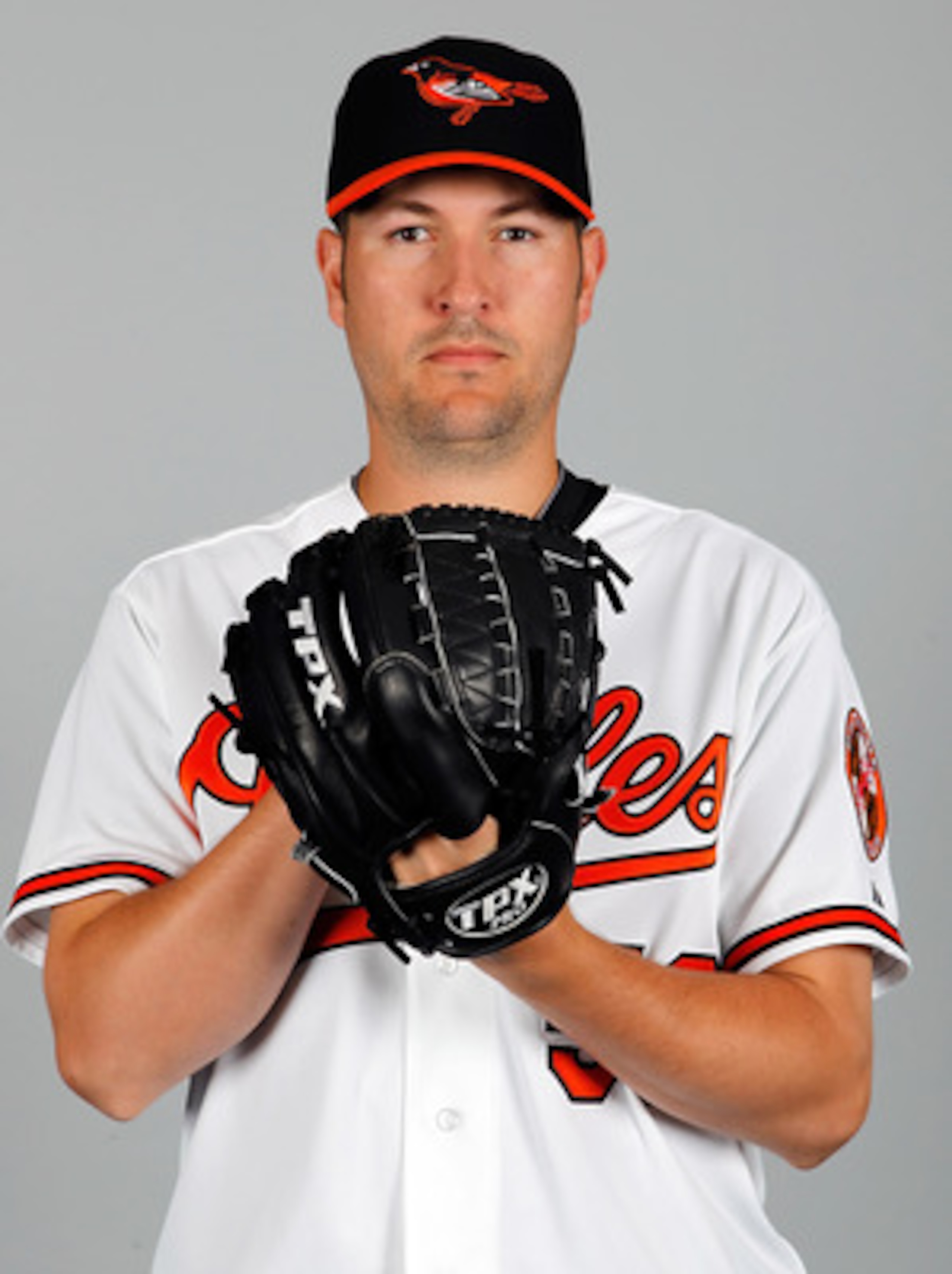 SARASOTA, FL - FEBRUARY 26:  Pitcher Justin Duchscherer #58 of the Baltimore Orioles poses for a photo during photo day at Ed Smith Stadium on February 26, 2011 in Sarasota, Florida.  (Photo by J. Meric/Getty Images)
