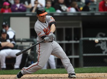 CHICAGO, IL - MAY 01: Mark Reynolds #12 of the Baltimore Orioles hits the ball against the Chicago White Sox at U.S. Cellular Field on May 1, 2011 in Chicago, Illinois. The Orioles defeated the White Sox 6-4. (Photo by Jonathan Daniel/Getty Images)