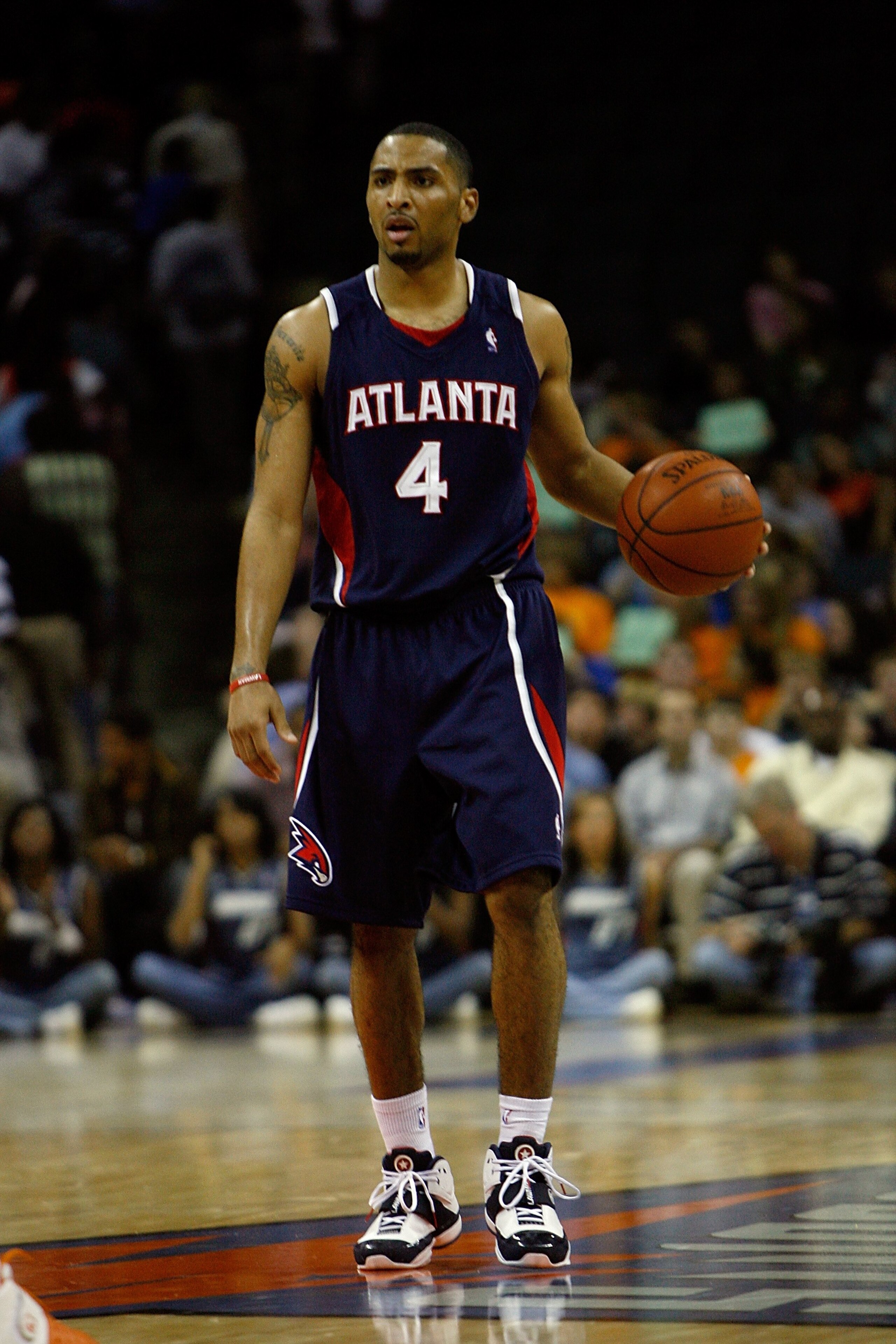 CHARLOTTE, NC - OCTOBER 18:  Acie Law #4 of the Atlanta Hawks brings the ball upcourt during the game against the Charlotte Bobcats at Charlotte Bobcats Arena on October 18, 2007 in Charlotte, North Carolina.  The Hawks won 104-98.  NOTE TO USER: User exp