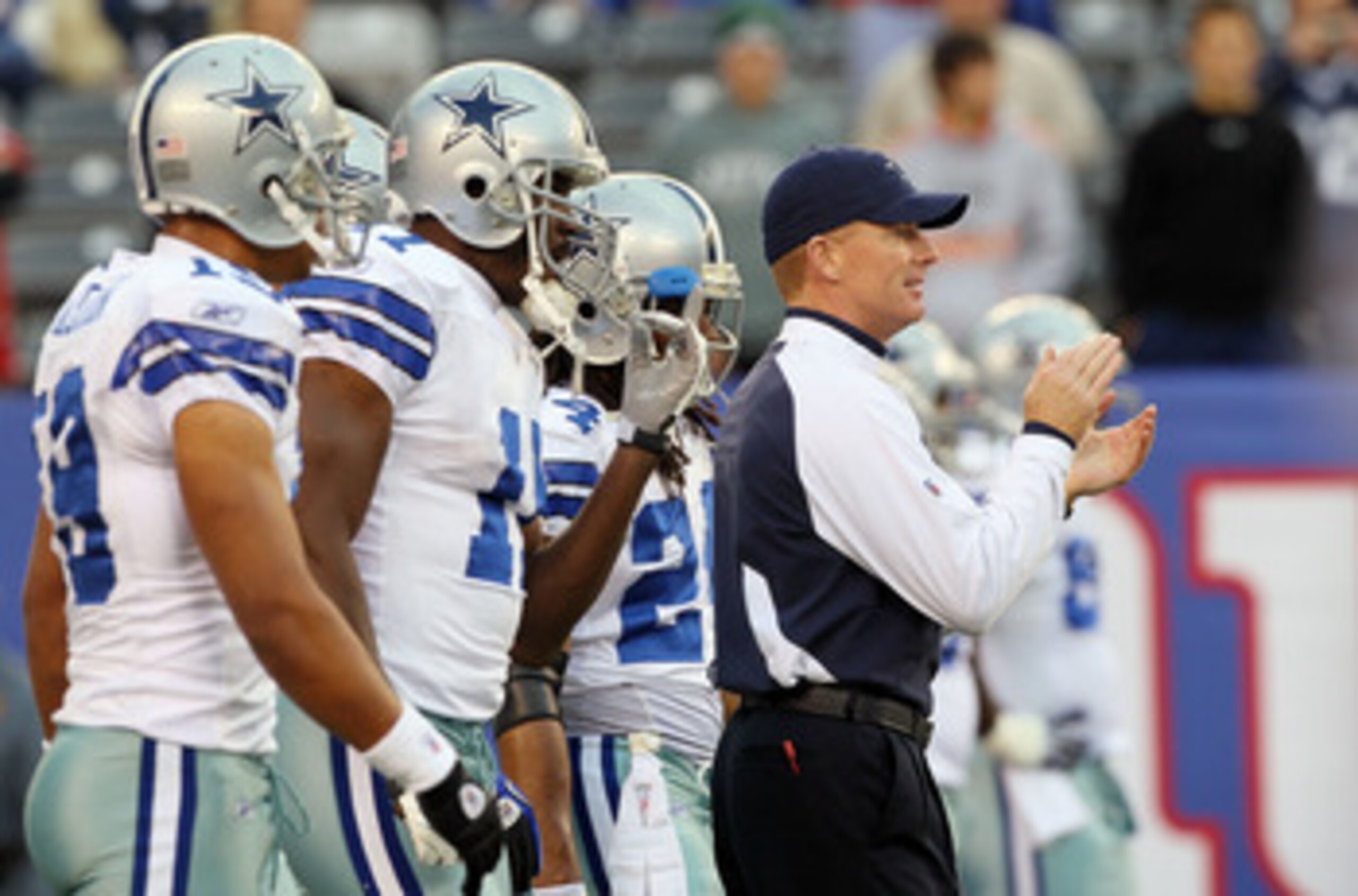 EAST RUTHERFORD, NJ - NOVEMBER 14:  Head coach Jason Garrett of the Dallas Cowboys works  with his team as they warm up prior to playing against the New York Giants on November 14, 2010 at the New Meadowlands Stadium in East Rutherford, New Jersey.  (Phot