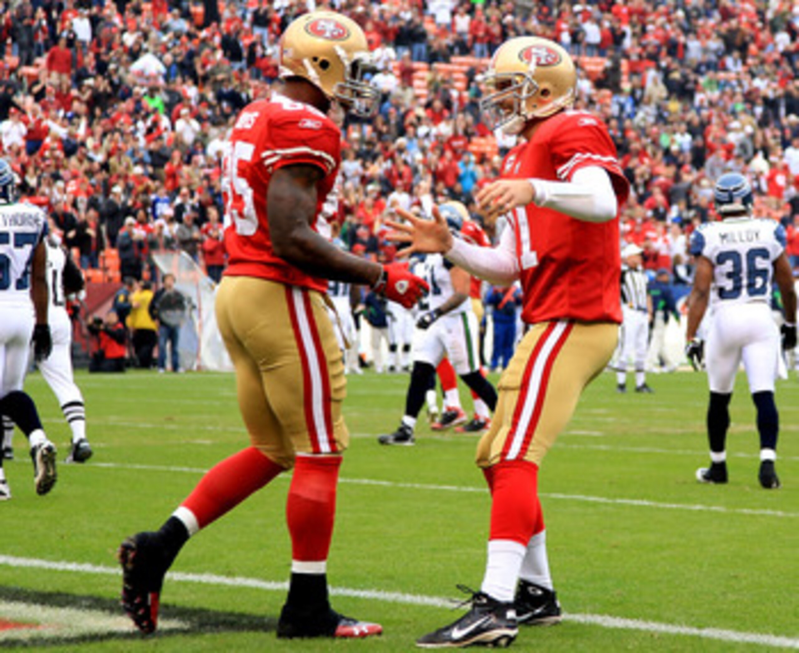 SAN FRANCISCO - DECEMBER 12:    Vernon Davis #85 of the San Francisco 49ers celebrates with Alex Smith #11 after a catching a touchdown against the Seattle Seahawks during an NFL game at Candlestick Park on December 12, 2010 in San Francisco, California.