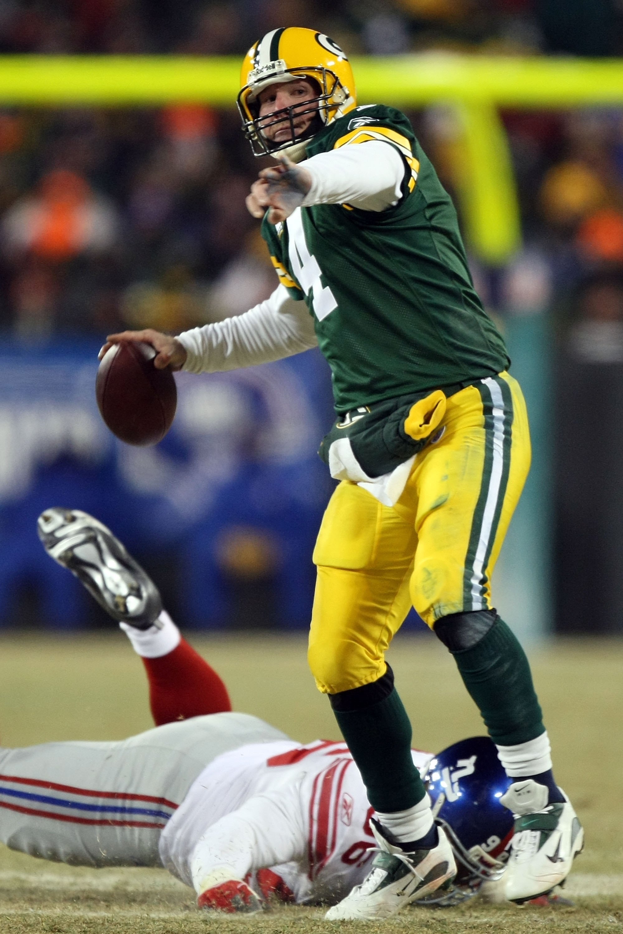 GREEN BAY, WI - JANUARY 20:  Quarterback Brett Favre #4 of the Green Bay Packers throws the ball during the NFC championship game against the New York Giants on January 20, 2008 at Lambeau Field in Green Bay, Wisconsin. The Giants defeated the Packers 23-