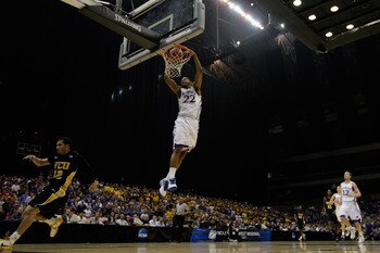 SAN ANTONIO, TX - MARCH 27:  Marcus Morris #22 of the Kansas Jayhawks dunks against the Virginia Commonwealth Rams during the southwest regional final of the 2011 NCAA men's basketball tournament at the Alamodome on March 27, 2011 in San Antonio, Texas.  