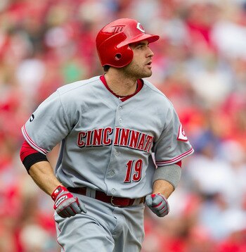 ST. LOUIS, MO - APRIL 23: Joey Votto #19 of the Cincinnati Reds watches his two-run home run leave the park against the St. Louis Cardinals at Busch Stadium on April 23, 2011 in St. Louis, Missouri.  (Photo by Dilip Vishwanat/Getty Images)