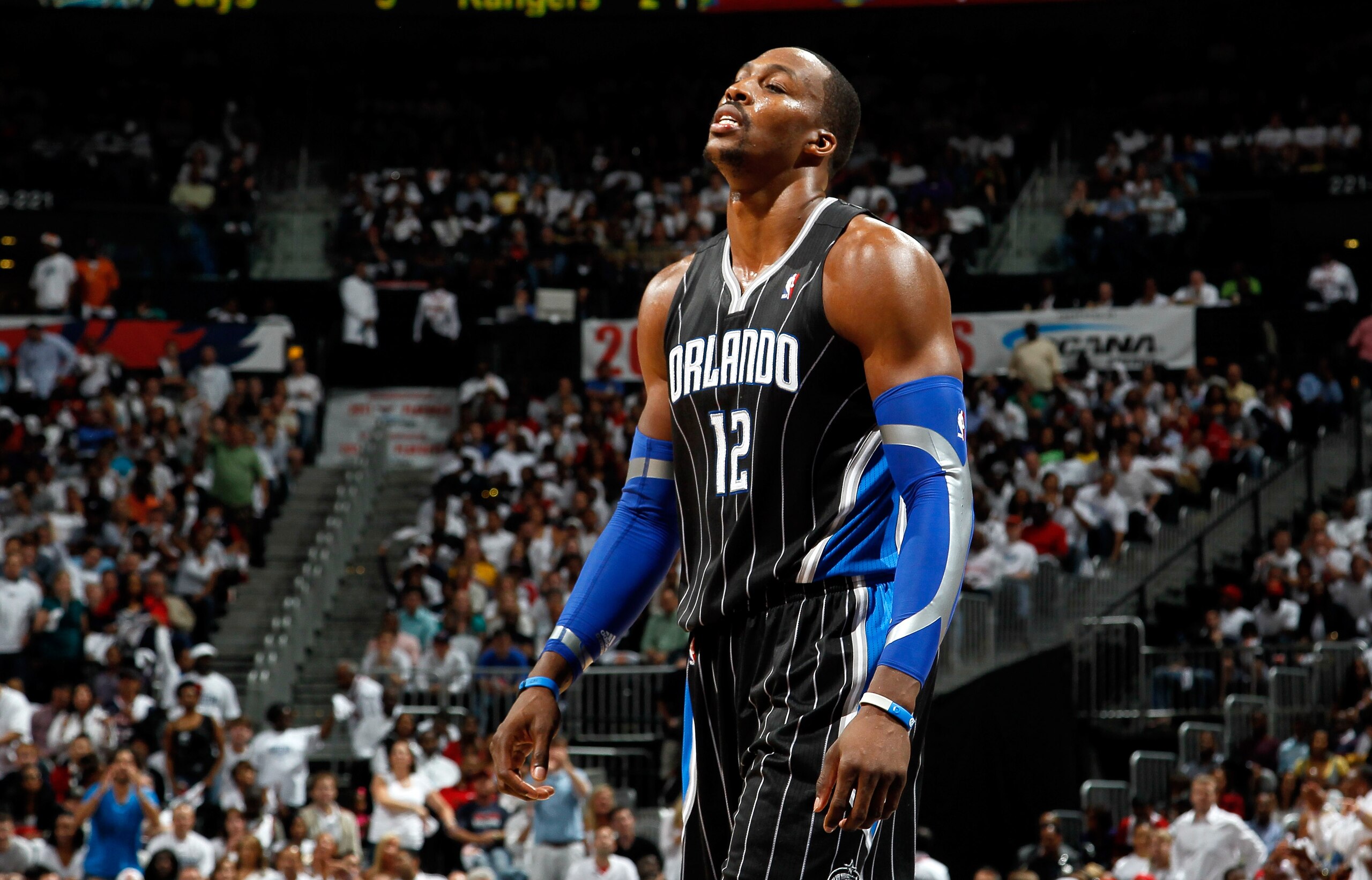 ATLANTA, GA - APRIL 28:  Dwight Howard #12 of the Orlando Magic walks to the bench after a turnover to the Atlanta Hawks during Game Six of the Eastern Conference Quarterfinals in the 2011 NBA Playoffs at Philips Arena on April 28, 2011 in Atlanta, Georgi
