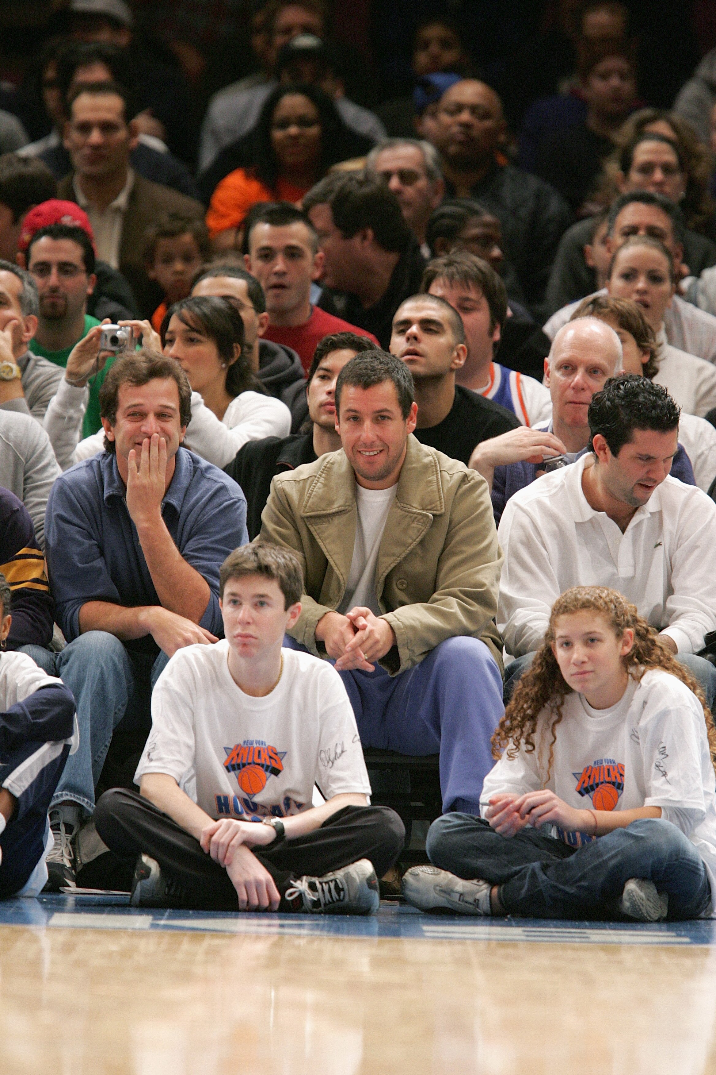 NEW YORK - DECEMBER 12:  New York Knicks fans Allen Covert (L) and Adam Sandler watch the game with the Denver Nuggets on December 12 2004 at Madison Square Garden in New York City, New York. The Knicks won 107-96. NOTE TO USER: User expressly acknowledge
