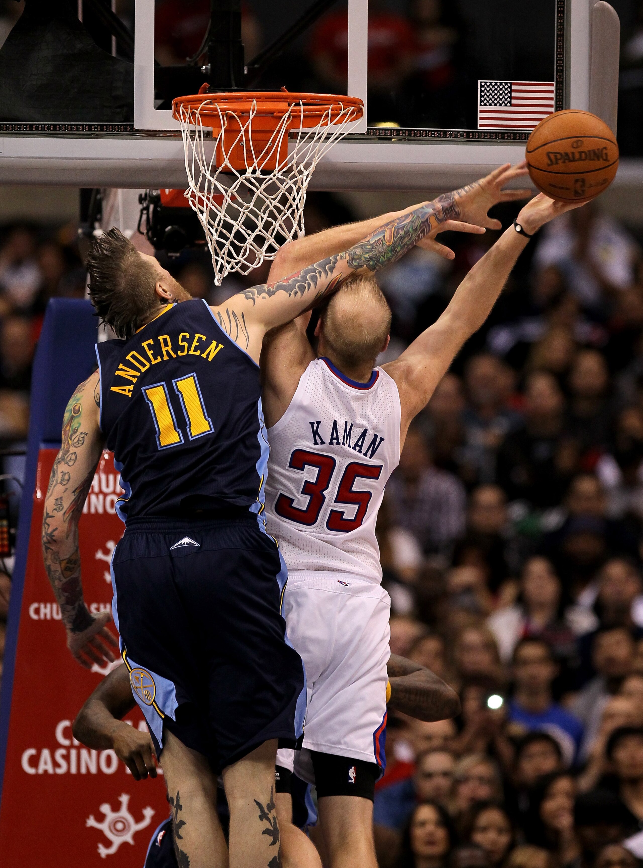 LOS ANGELES, CA - MARCH 5:   Chris Andersen #11 of the Denver Nuggets blocks a shot attempt by Chris Kaman #35 of the Los Angeles Clippers at Staples Center on March 5, 2011 in Los Angeles, California. The Clippers won 100-94. NOTE TO USER: User expressly