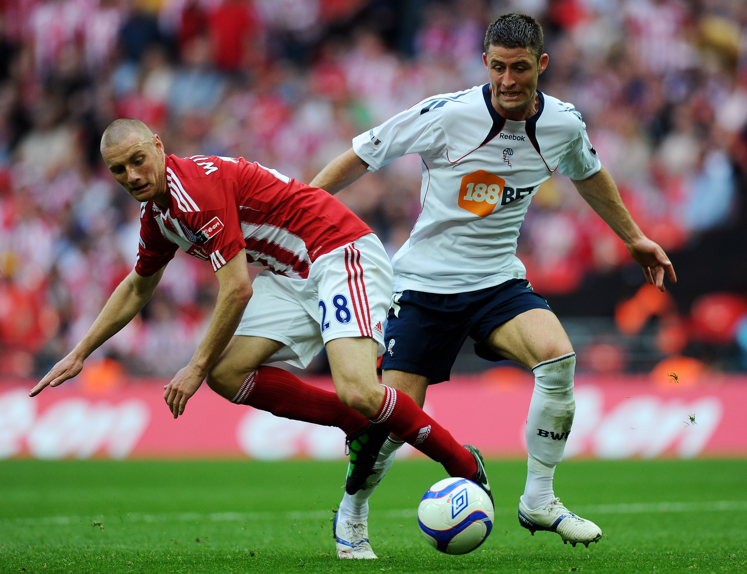 LONDON, ENGLAND - APRIL 17:  Andy Wilkinson of Stoke is challenged by Gary Cahill of Bolton during the FA Cup sponsored by E.ON semi final between match Bolton Wanderers and Stoke City at Wembley Stadium on April 17, 2011 in London, England.  (Photo by Mi