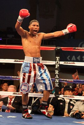 ATLANTIC CITY, NJ - MARCH 26: Yuriorkis Gamboa celebrates after winning the IBF WBA World Featherweight title by beating Jorge Solis of Mexico during Top Rank's 'Featherweight Fury' on March 26, 2011 at Boardwalk Hall in Atlantic City, New Jersey. (Photo