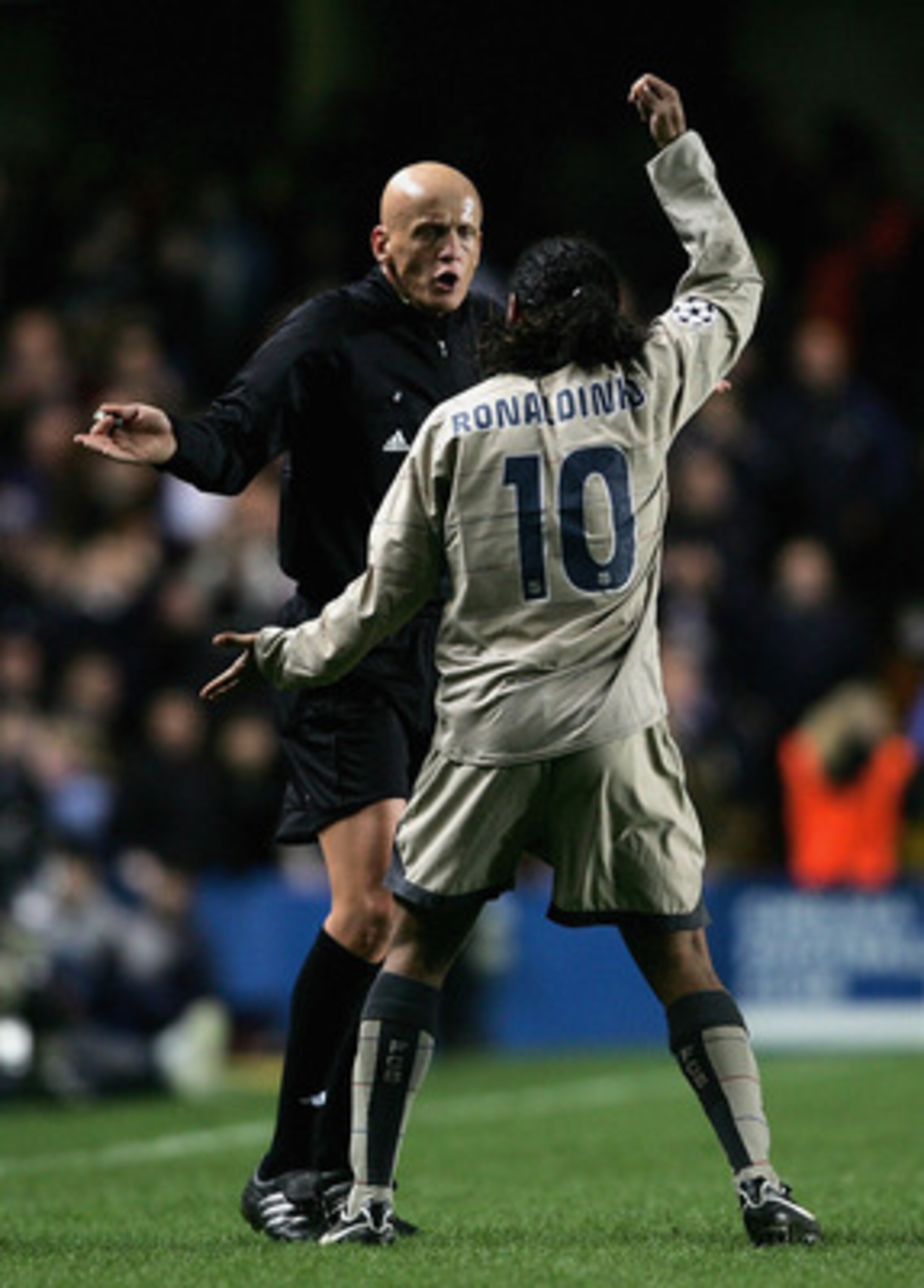 LONDON - MARCH 8: Ronaldinho of Barcelona complains at Pierluigi Collina, the referee, during the UEFA Champions League, First Knockout Round, Second Leg match between Chelsea and Barcelona at Stamford Bridge on March 8, 2005 in London, England.  (Photo b